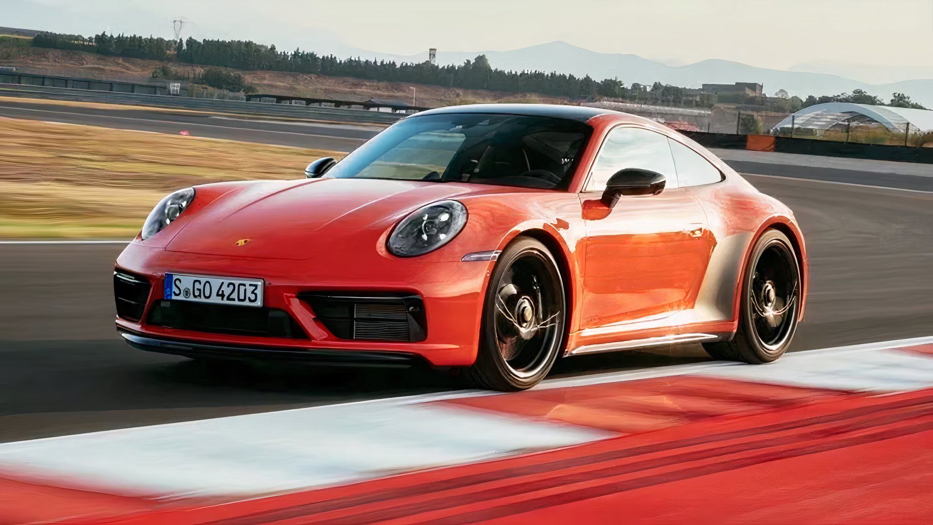 2024-porsche-911-carrera-4-gts-coupe-in-orange 10 Cheap Sports Cars That Can Keep Up With A BMW M4