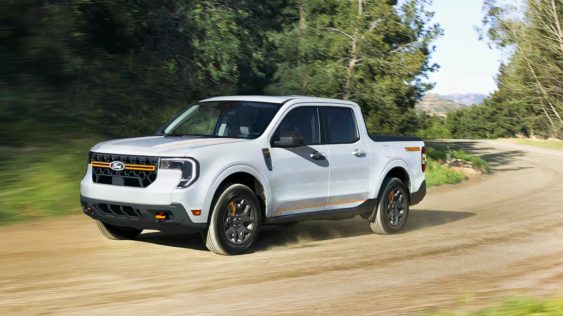 A white Ford Maverick Tremor 2025 drives off-road. 