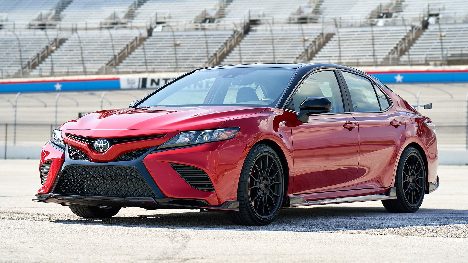 A front, left hand-side perspective shot of a 2020 Toyota Camry at the track