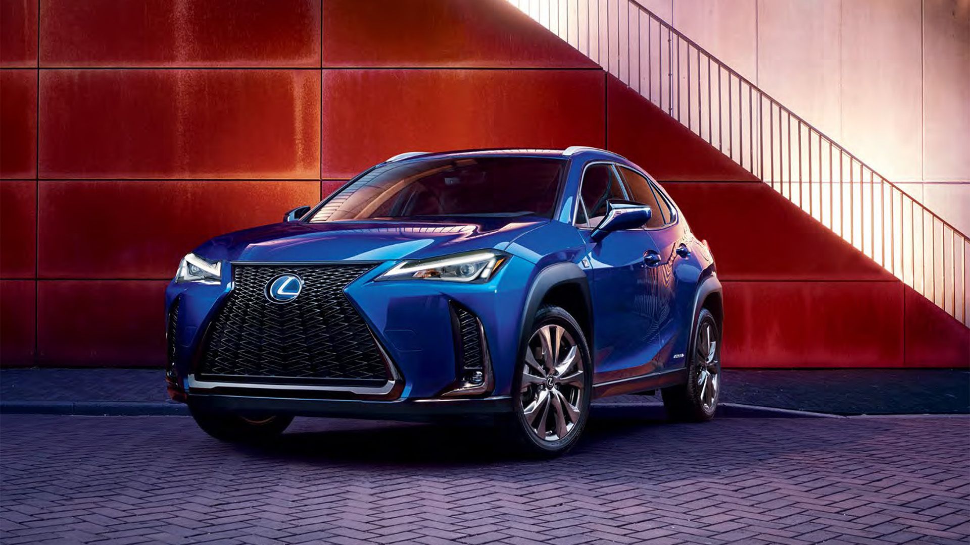 A front shot of a stationery 2020 Lexus UXh in Ultrasonic Blue