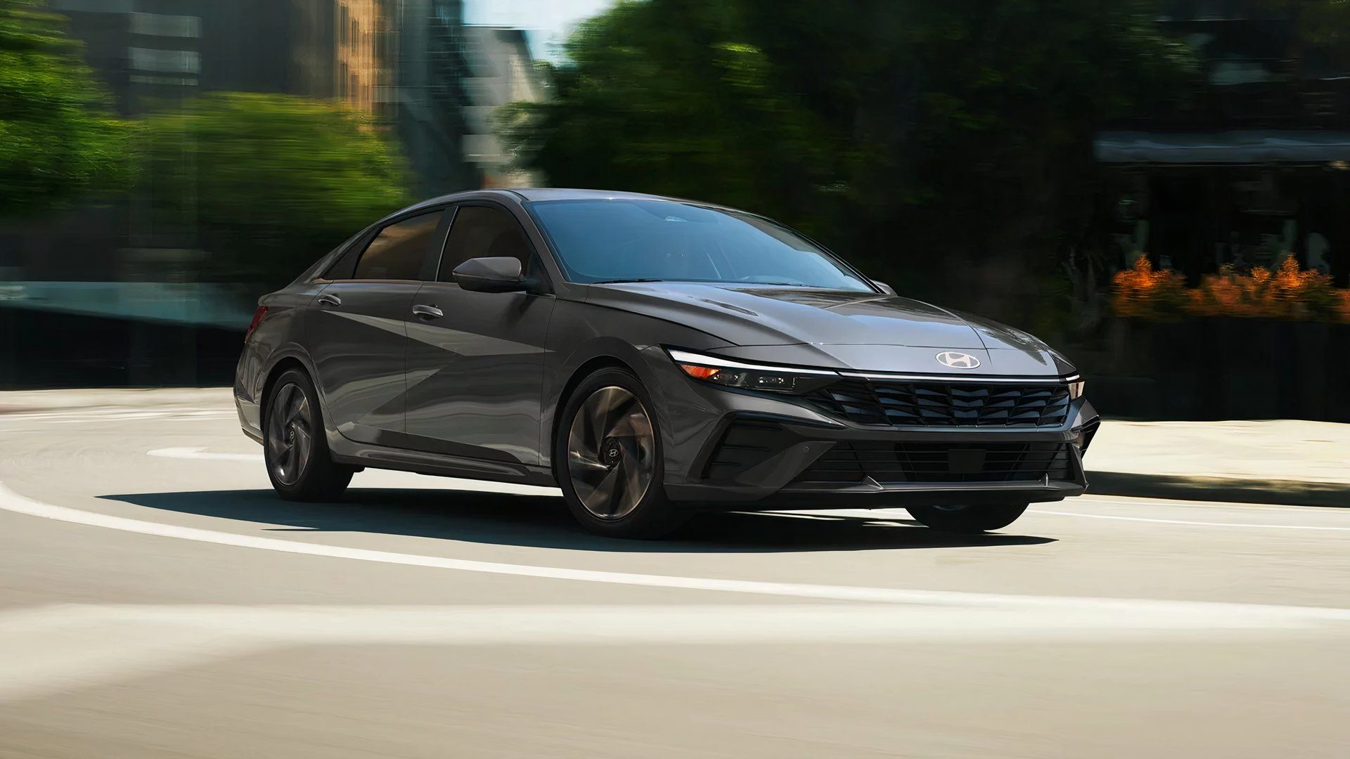 A gray Hyundai Elantra Hybrid is driving. 