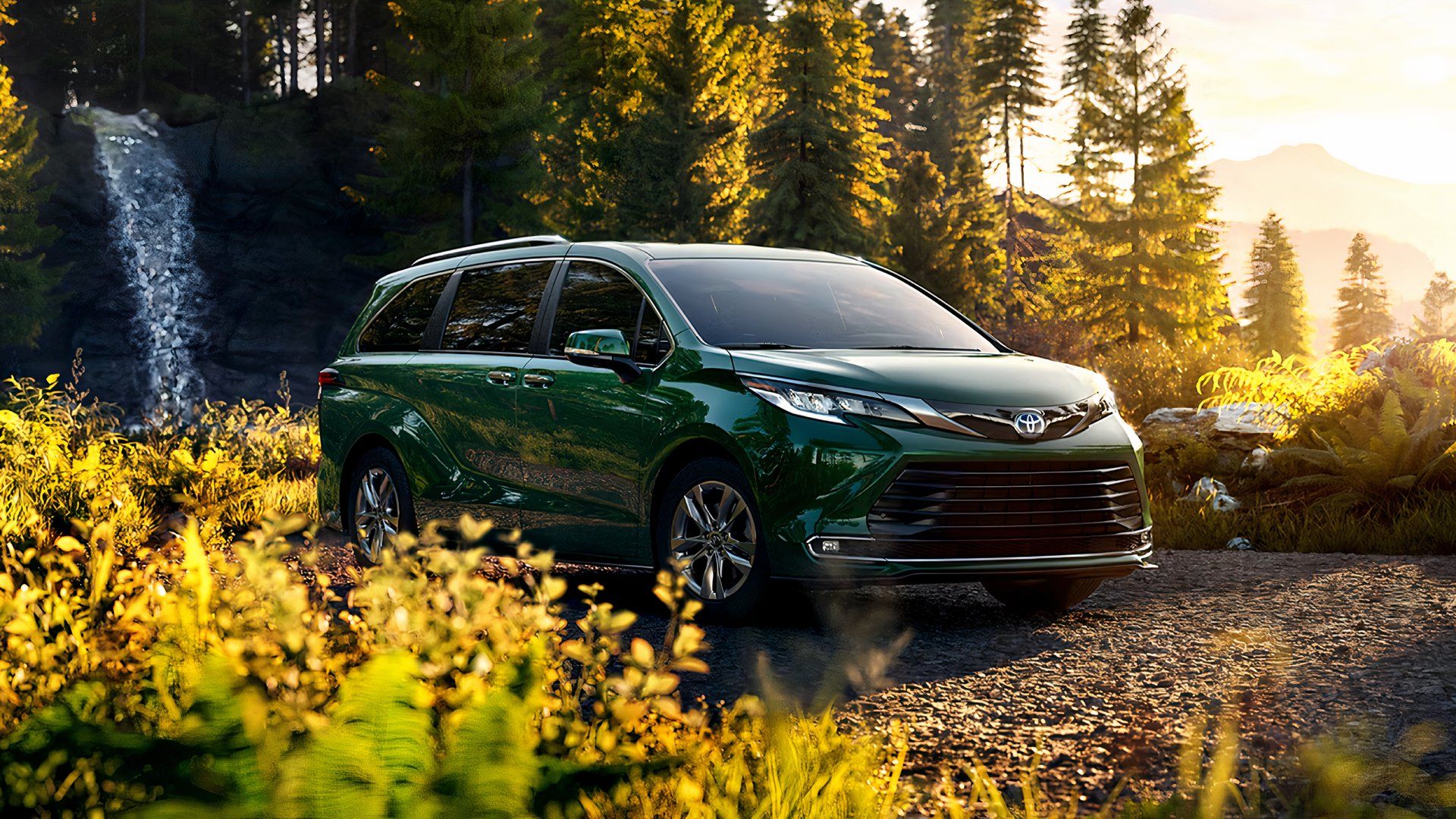 Toyota Sienna Hybrid parked in a scenic mountain location, ready for a road trip