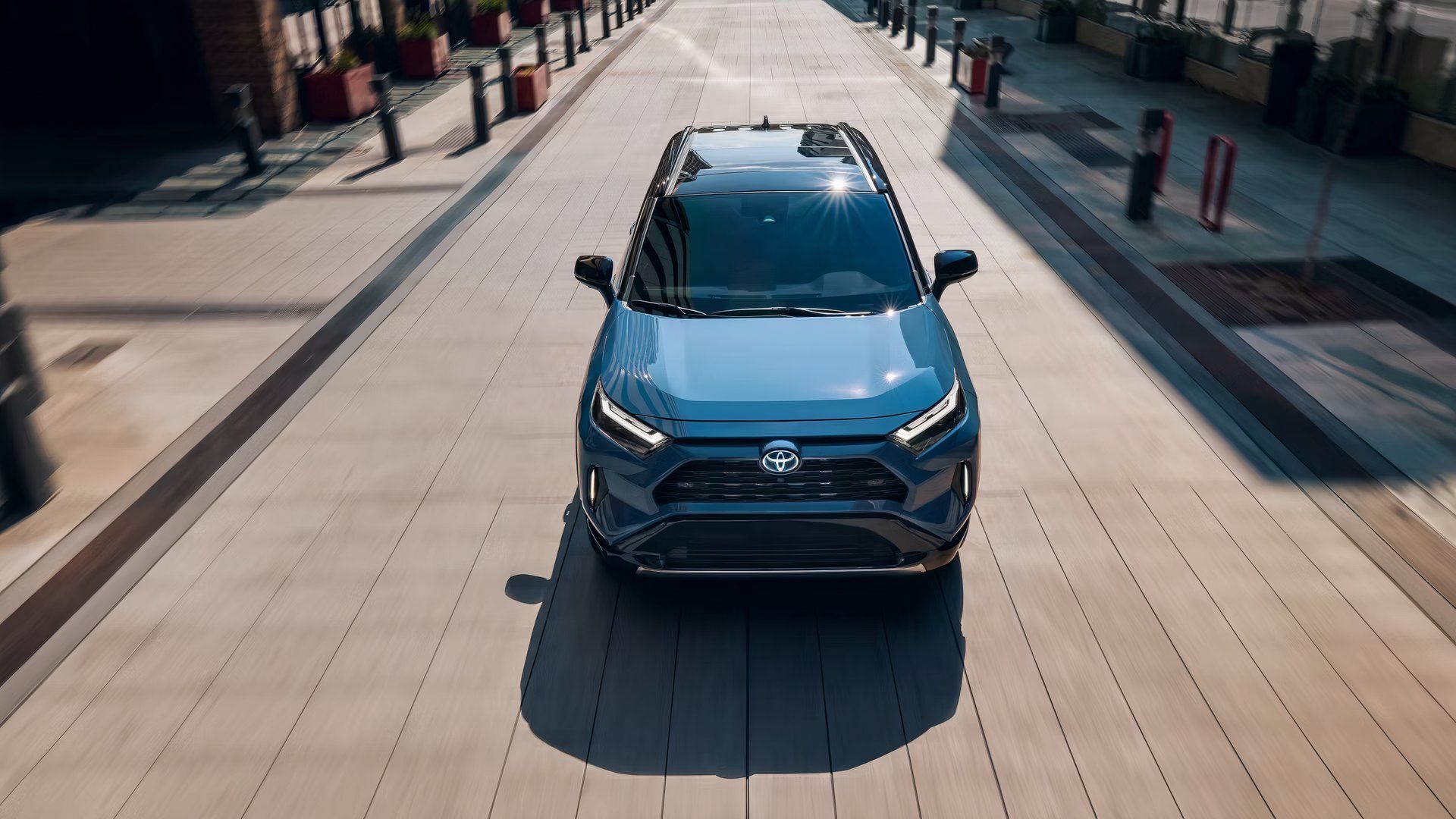 A blue Toyota RAV4 Hybrid small hybrid SUV. 