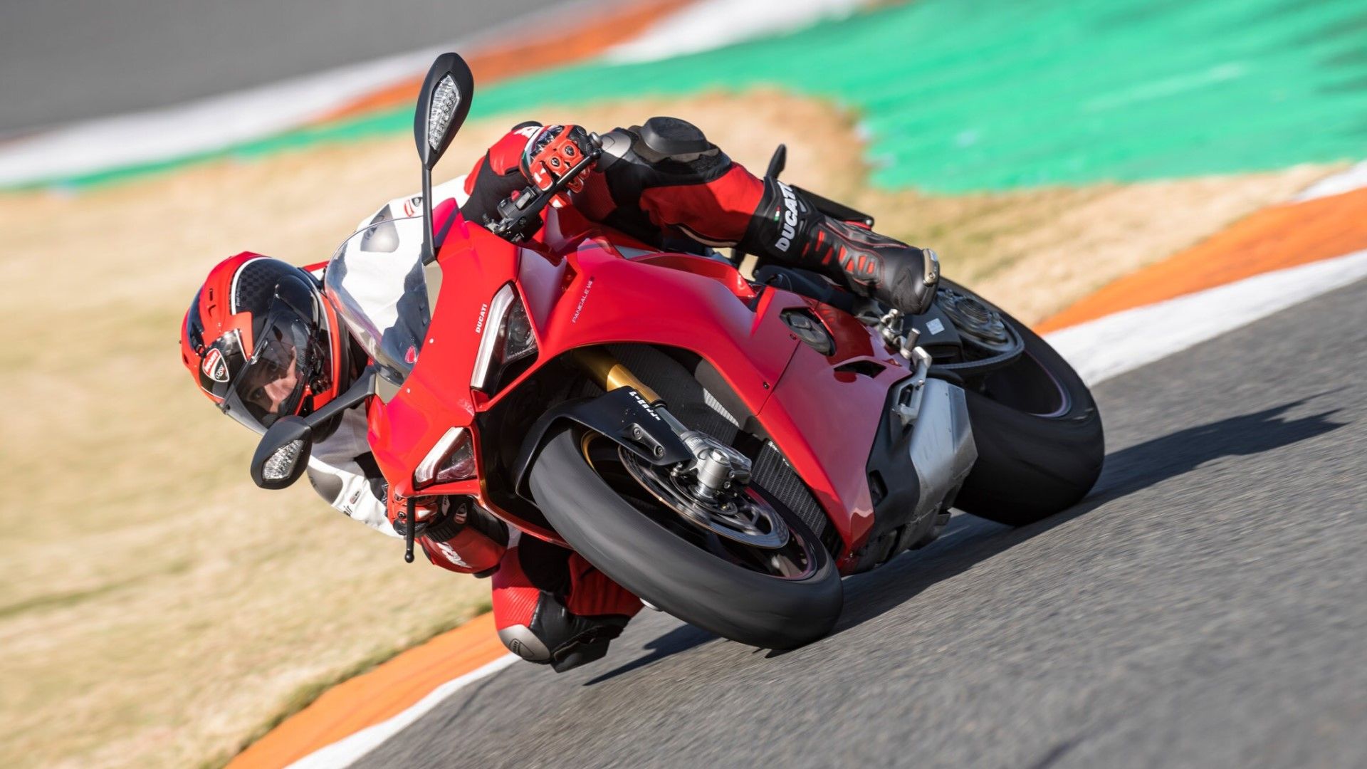 2019 Ducati Panigale V4 cornering on racetrack hd wallpaper view