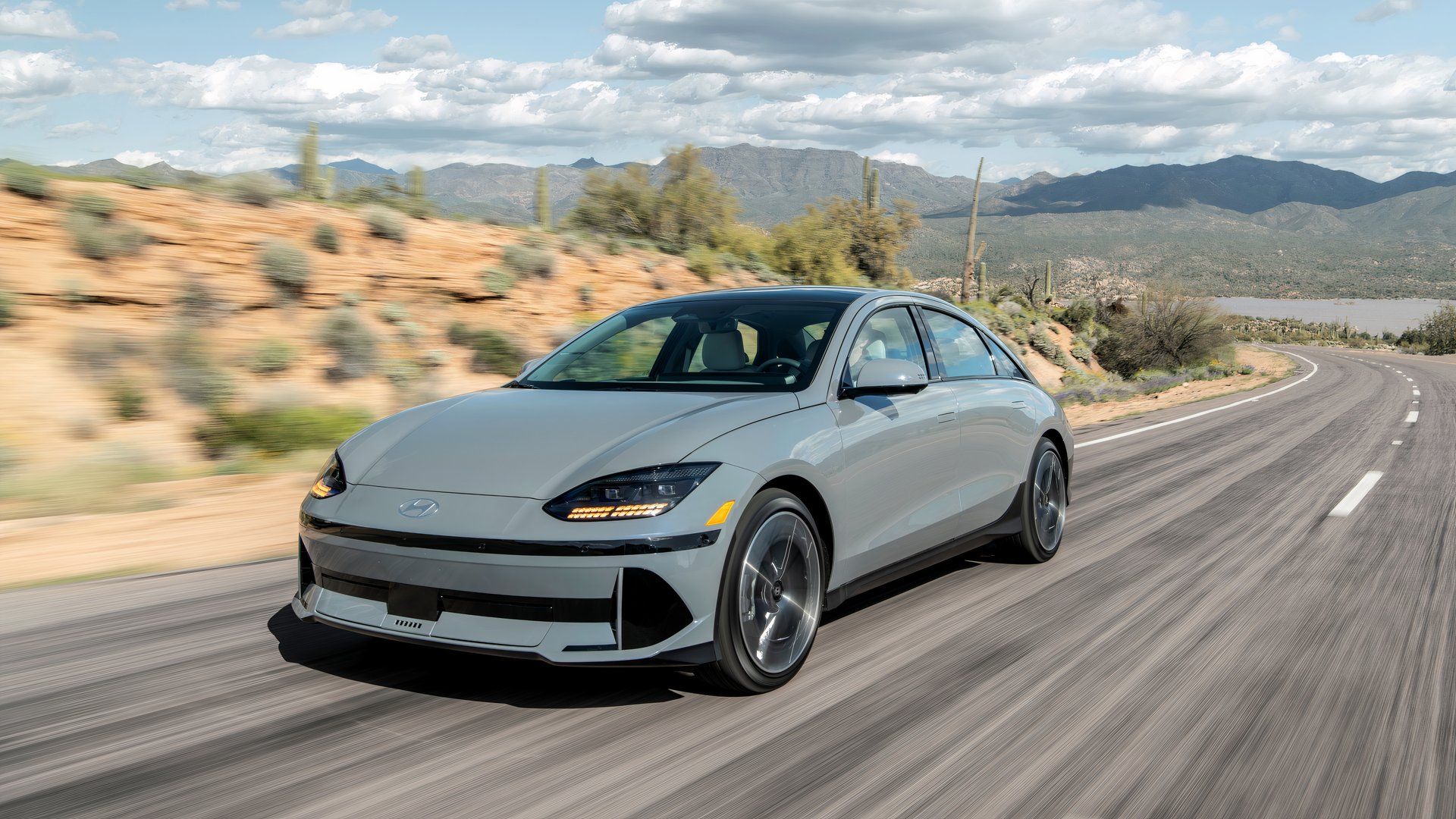 2024 Hyundai Ioniq 6 Limited in gray driving along desert road