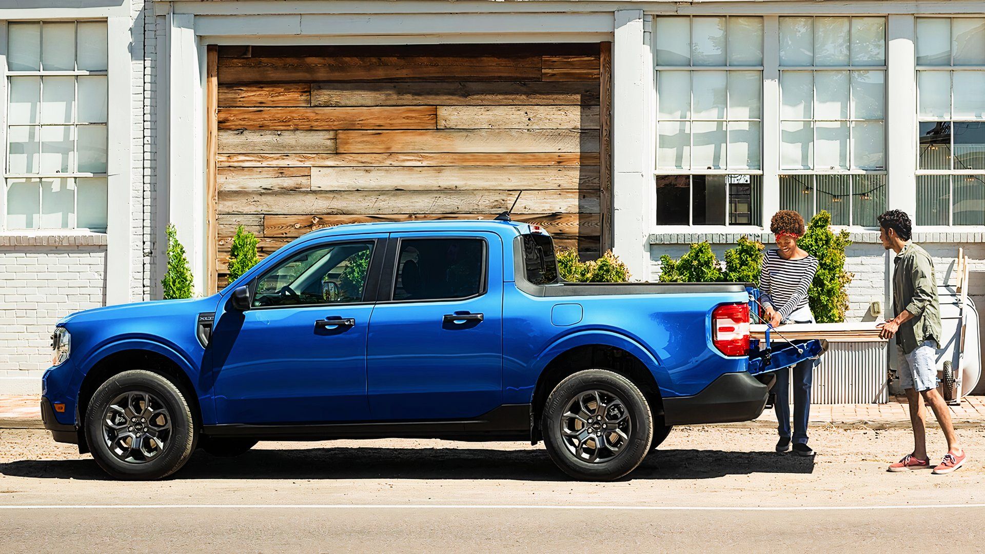 A blue Ford Maverick Hybrid small hybrid pickup truck. 