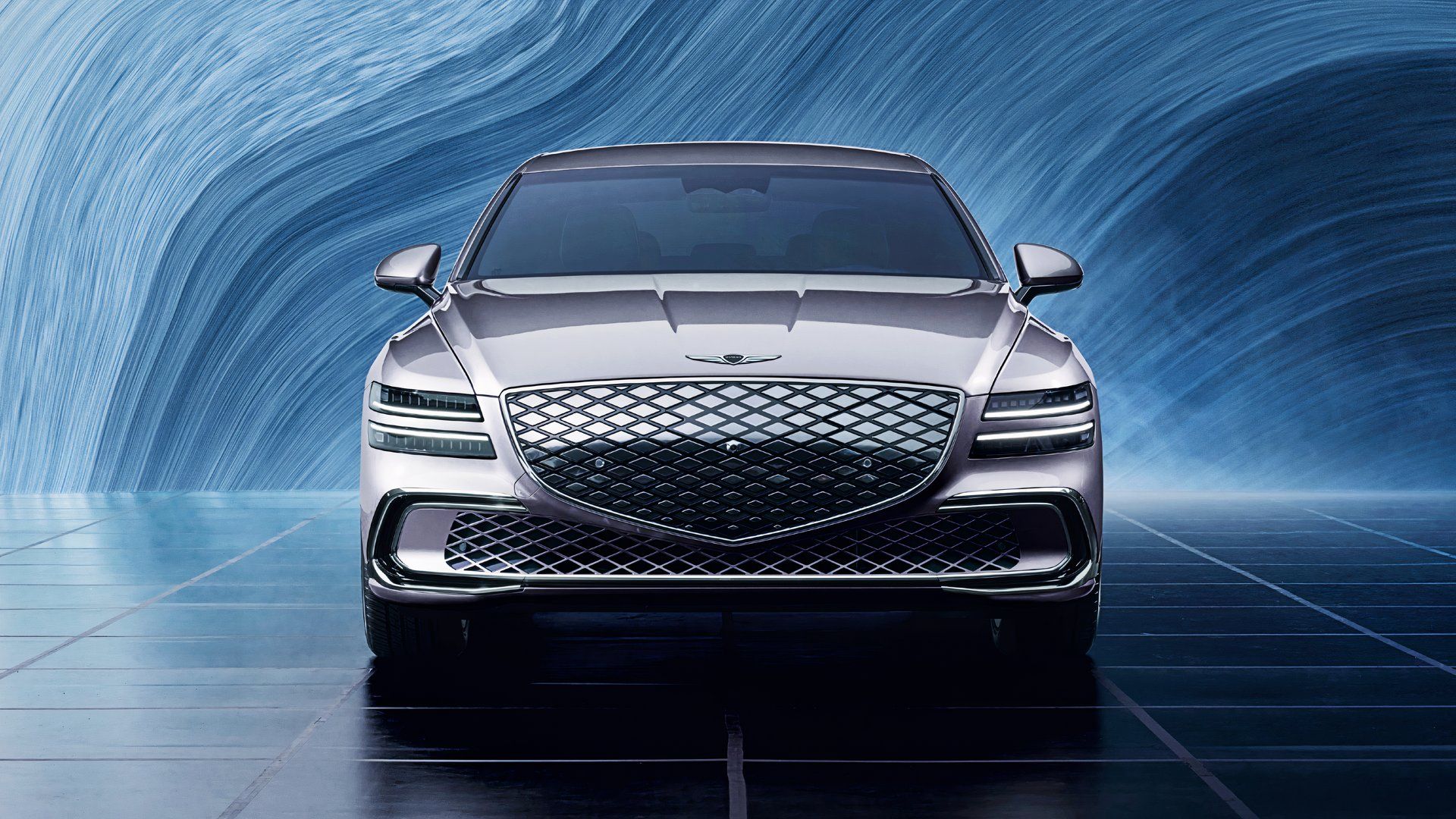 A gray Genesis Electrified G80 electric sedan. 