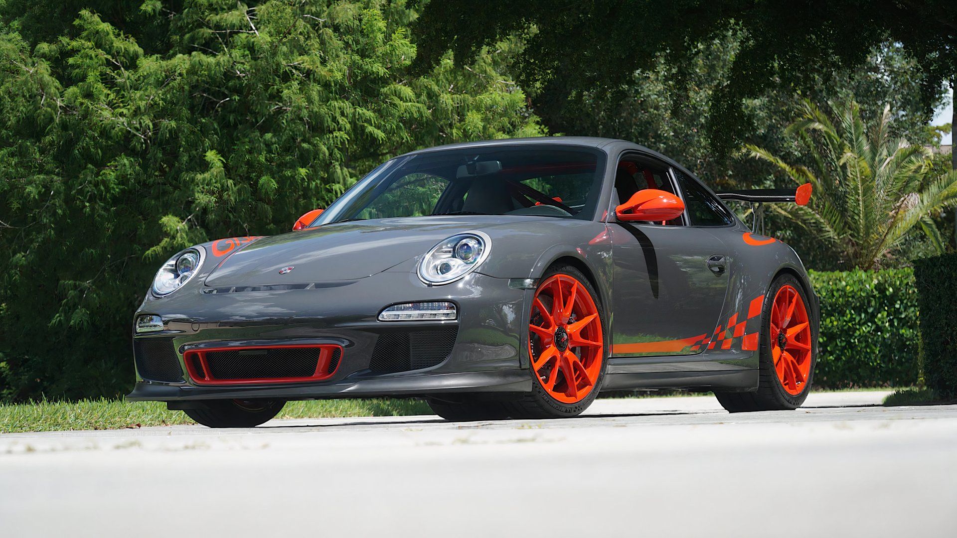 2011 Porsche 997 GT3 RS in gray and orange posing in driveway