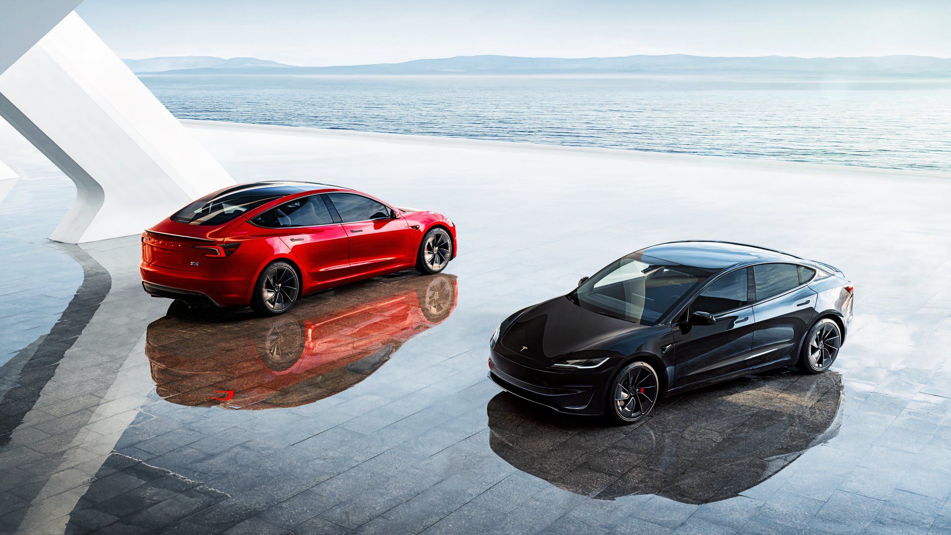 A red Tesla Model 3 (L), a black Tesla Model 3 (R). 