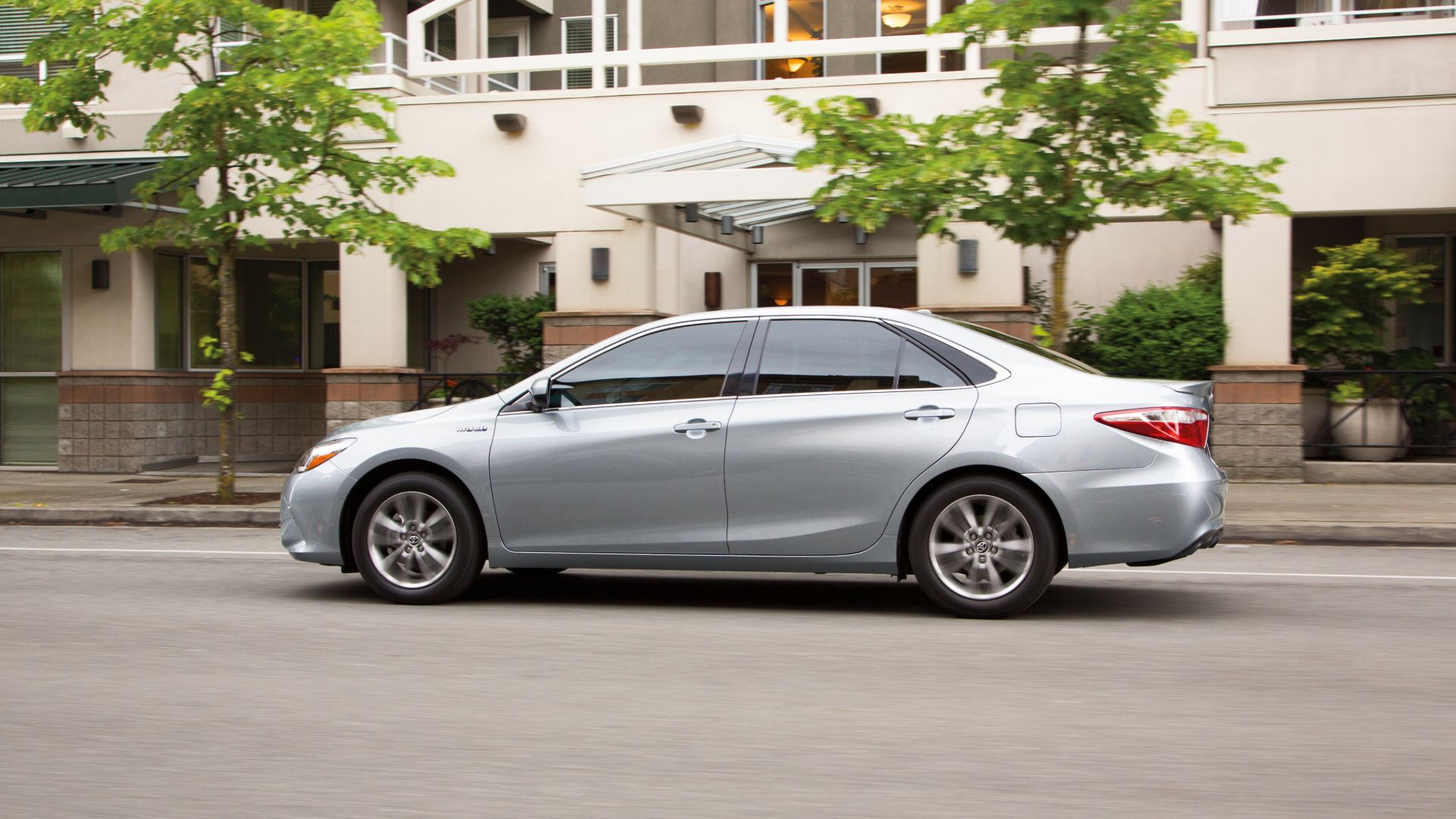 Side view of a 2017 silver Camry Hybrid