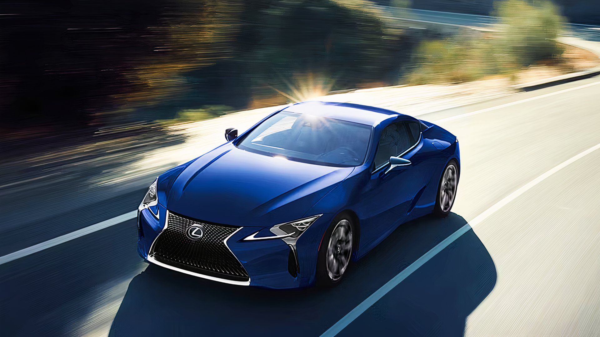 A blue 2024 Lexus LC 500h is driving on the road.
