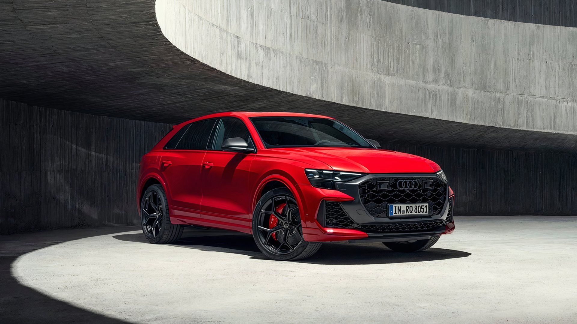 Front three-quarter view of a red Audi RS Q8 performance