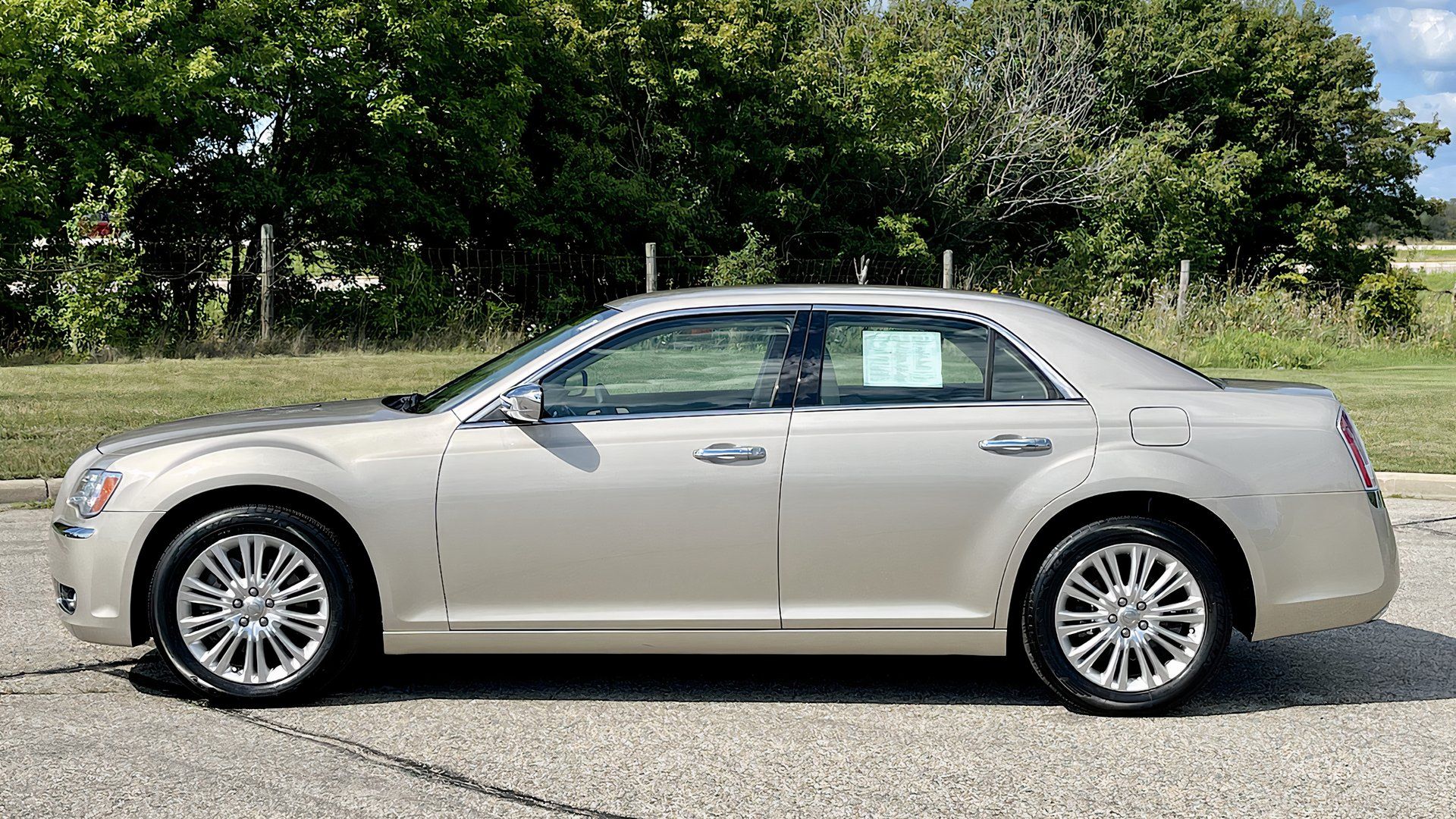 2001 Chrysler 300C in silver posing in parking lot