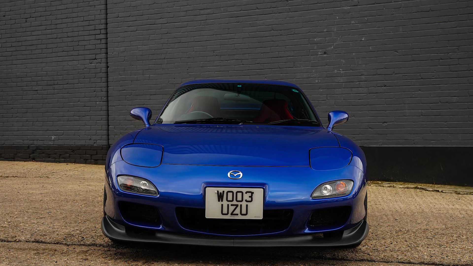 2002 Mazda RX-7 FD Spirit R in blue posing in garage