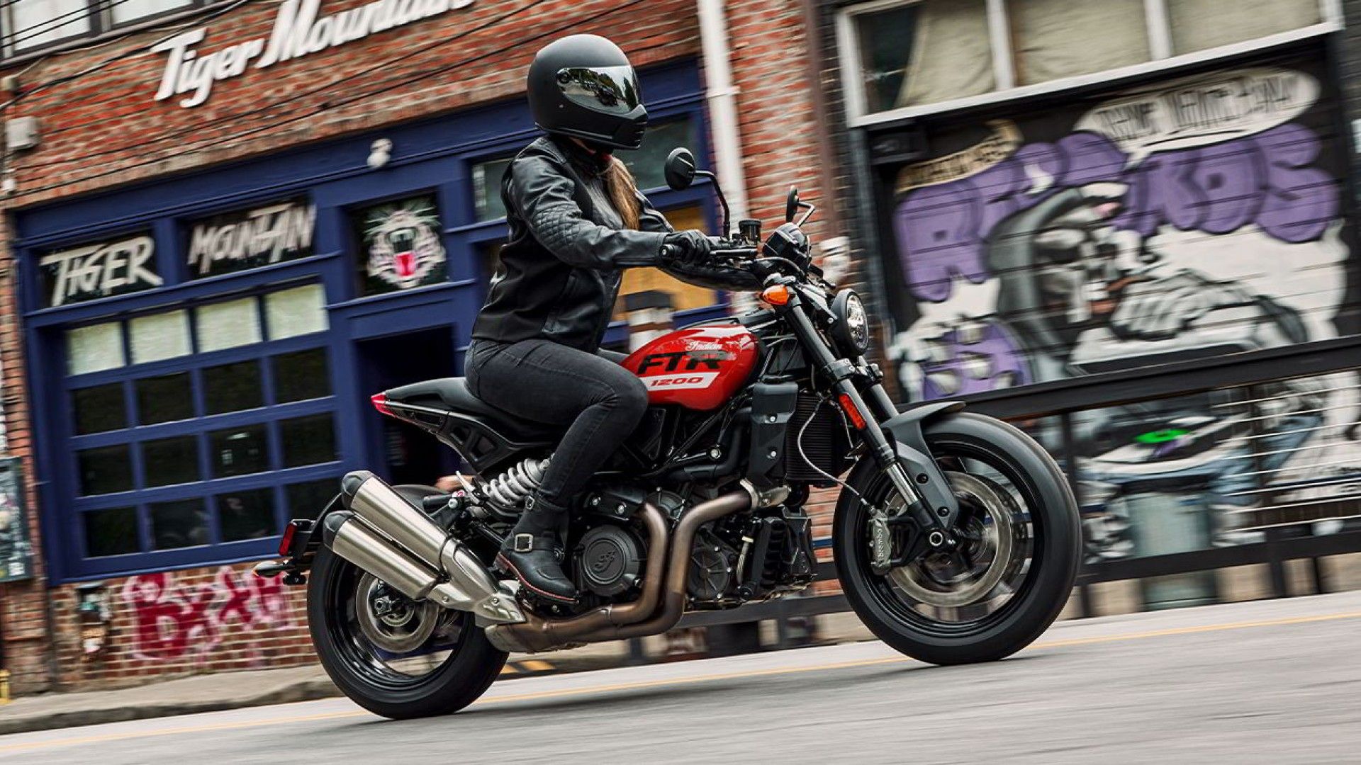 2024 Indian FTR 1200 accelerating on public road side profile view