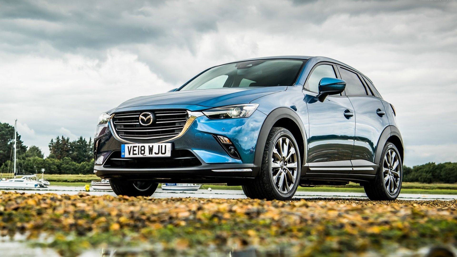 Low angle, front 3/4 shot of a 2019 Mazda CX-3