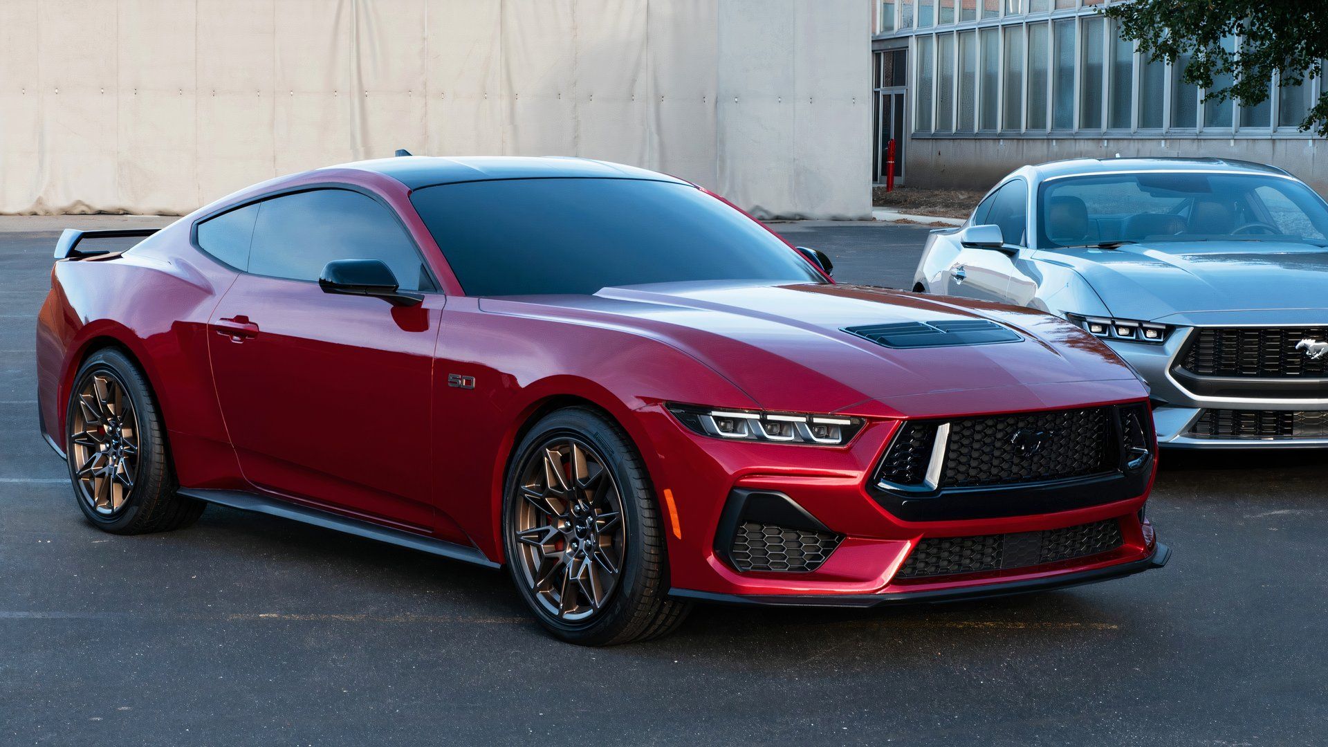 2024 Ford Mustang GT parked next to another Mustang