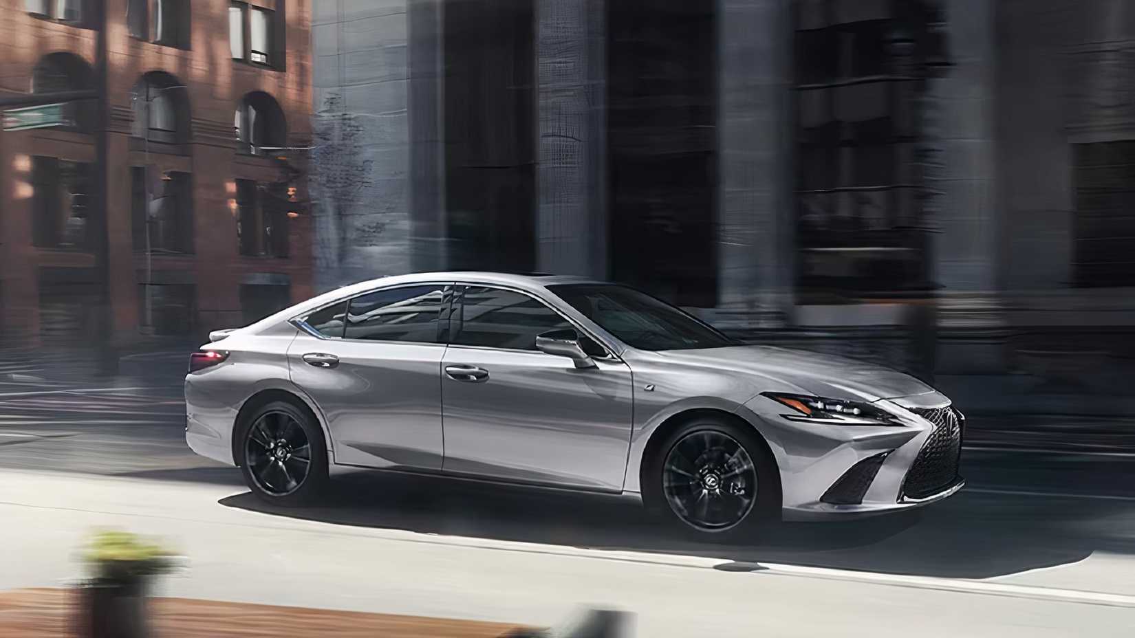 A gray 2025 Lexus ES 300h is driving. 