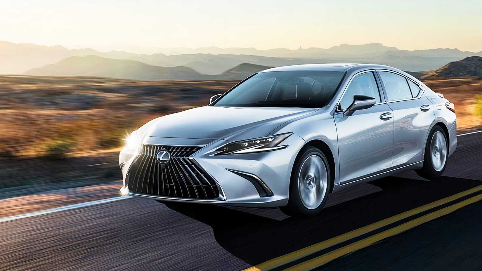 A gray Lexus ES Hybrid is driving on the road. 