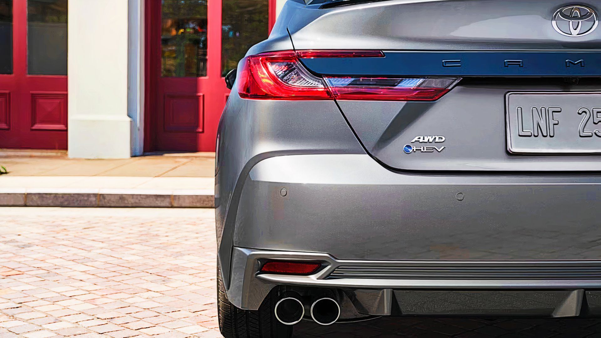 The rear of a gray Toyota Camry. 