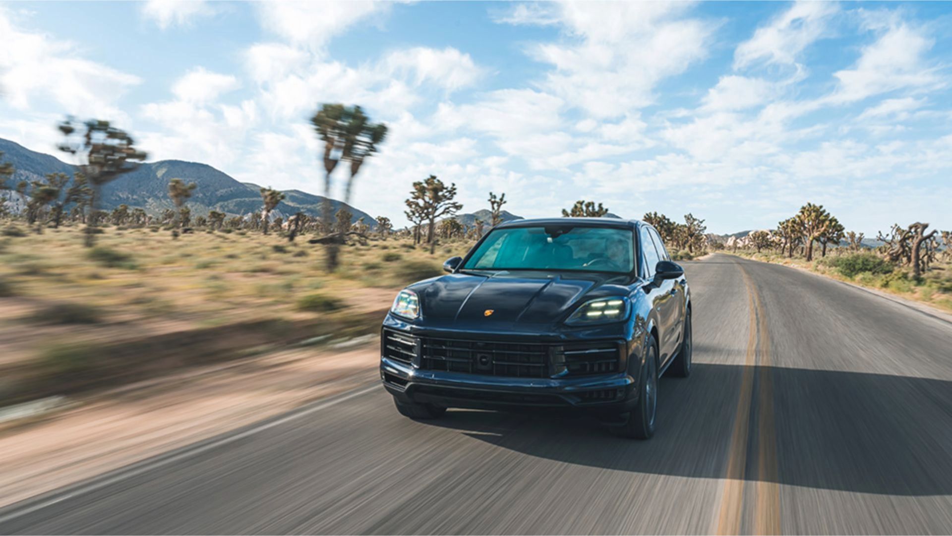 2024 2024 Porsche Cayenne E-Hybrid in Algarve Blue Metallic, front driving shot