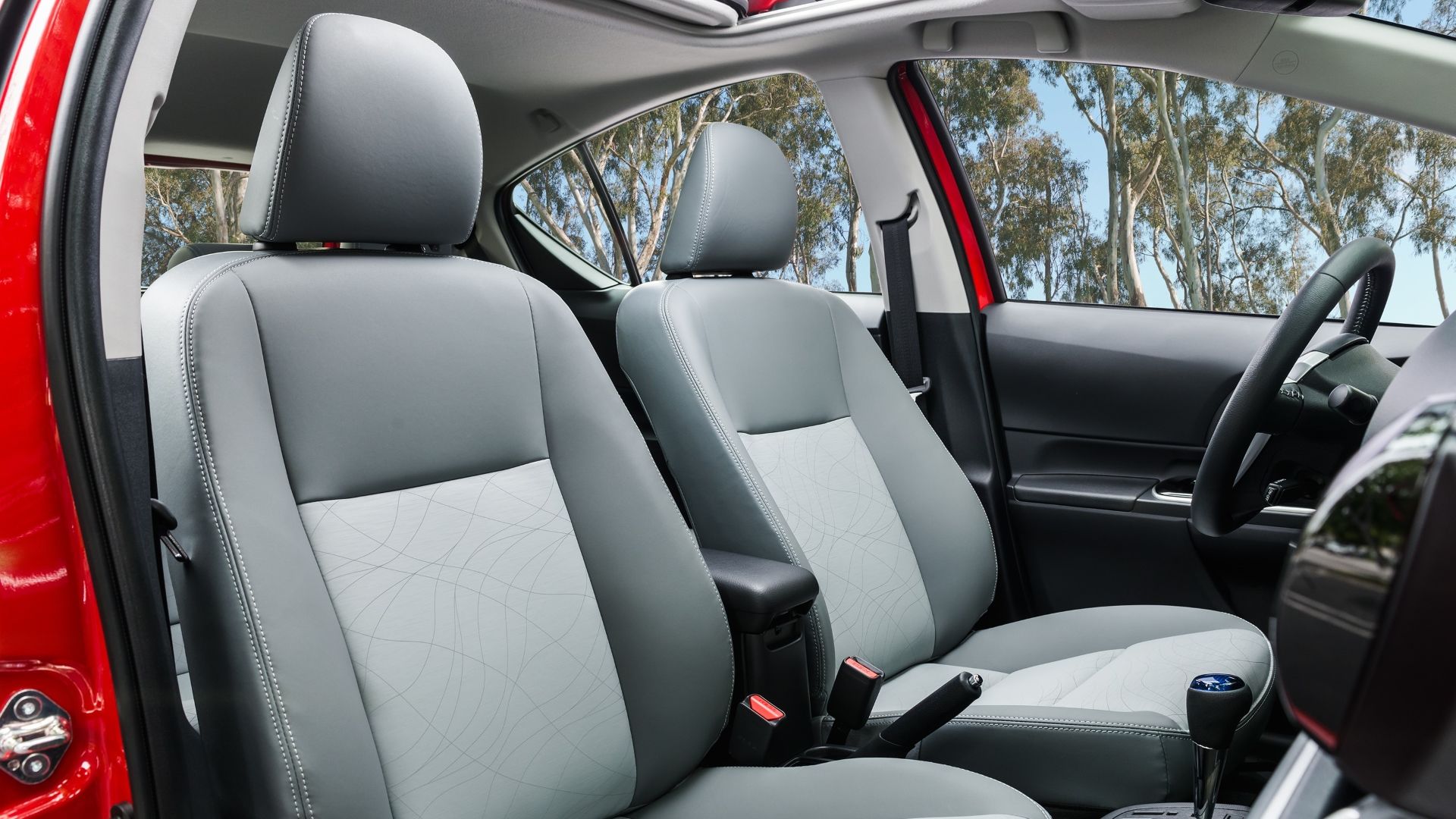 Interior shot of the front seats in the 2016 Toyota Prius C