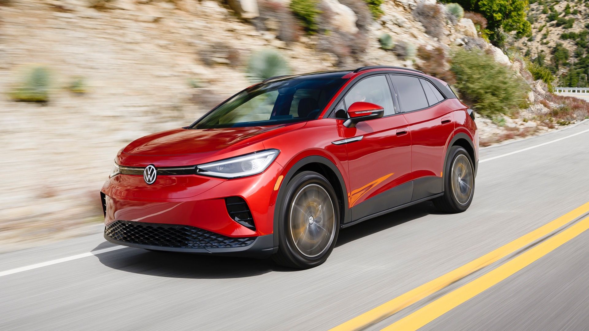 2024 Volkswagen ID.4 in red, front three-quarters driving shot