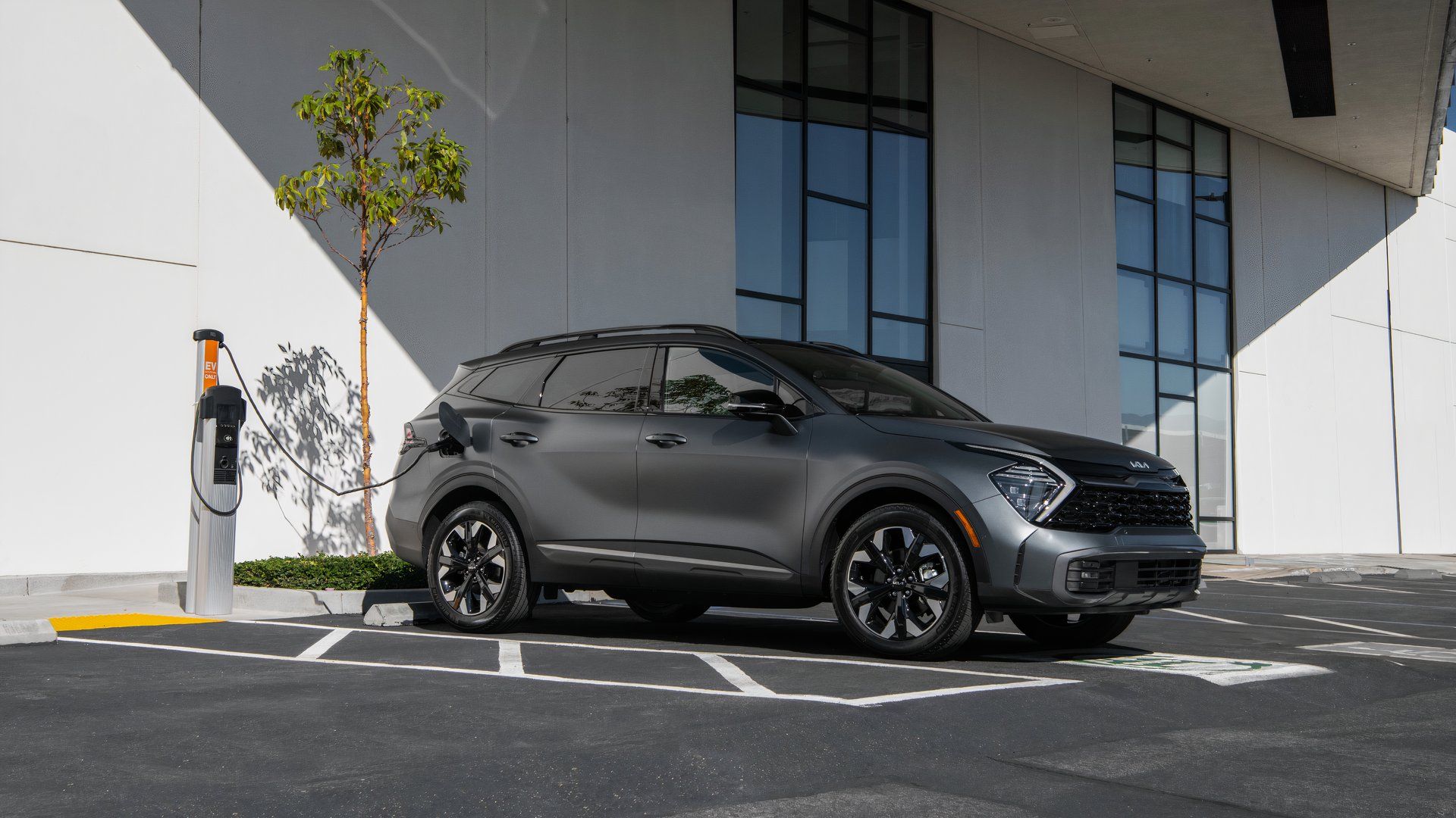 Side profile shot of a 2025 Kia Sportage PHEV charging