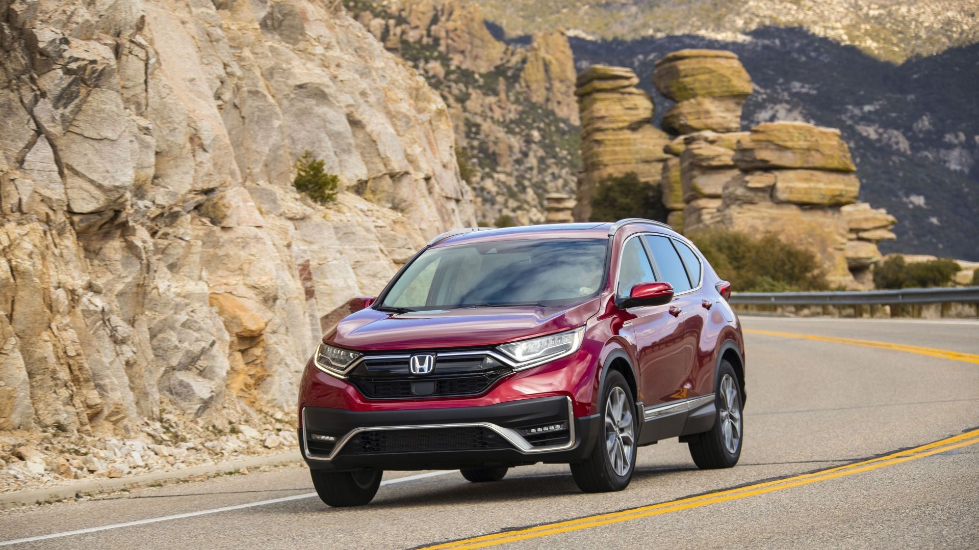 Front 3/4 action shot of a 2020 Honda CR-V Hybrid