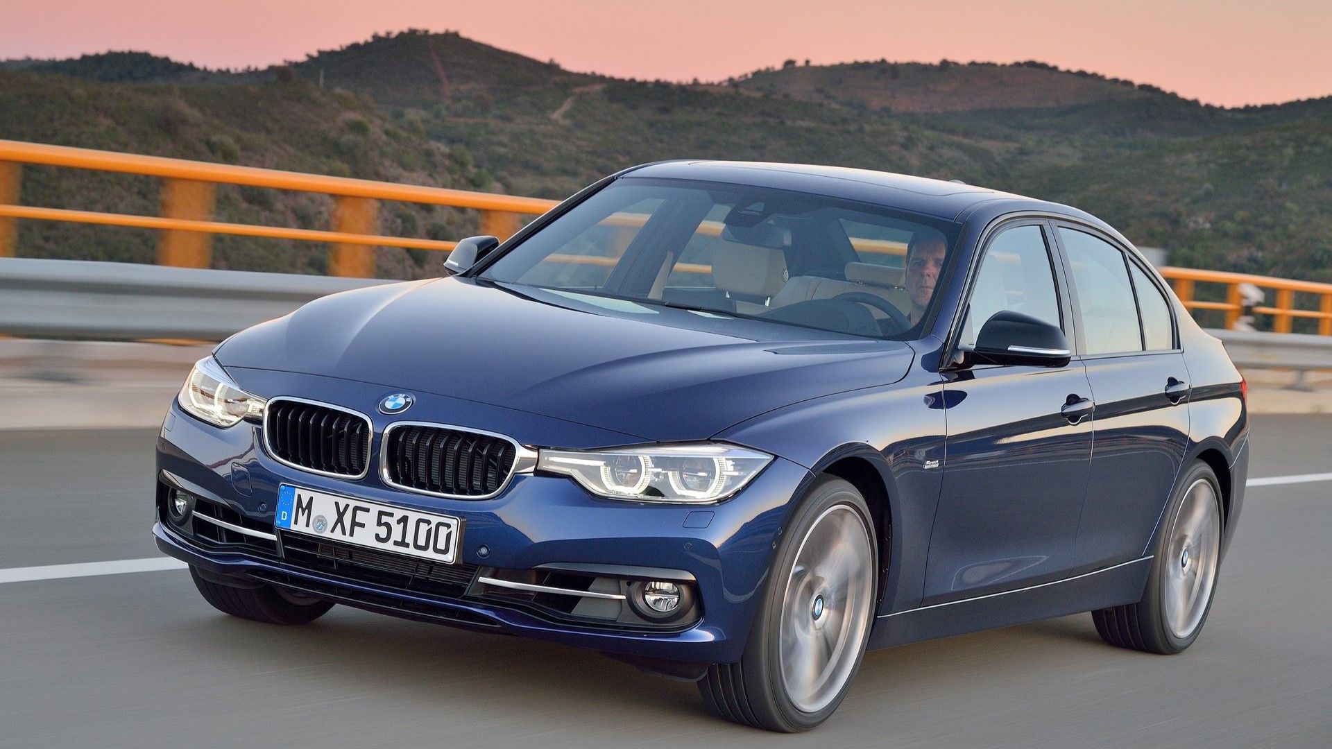 Front 3/4 action shot of a 2016 BMW 3-Series