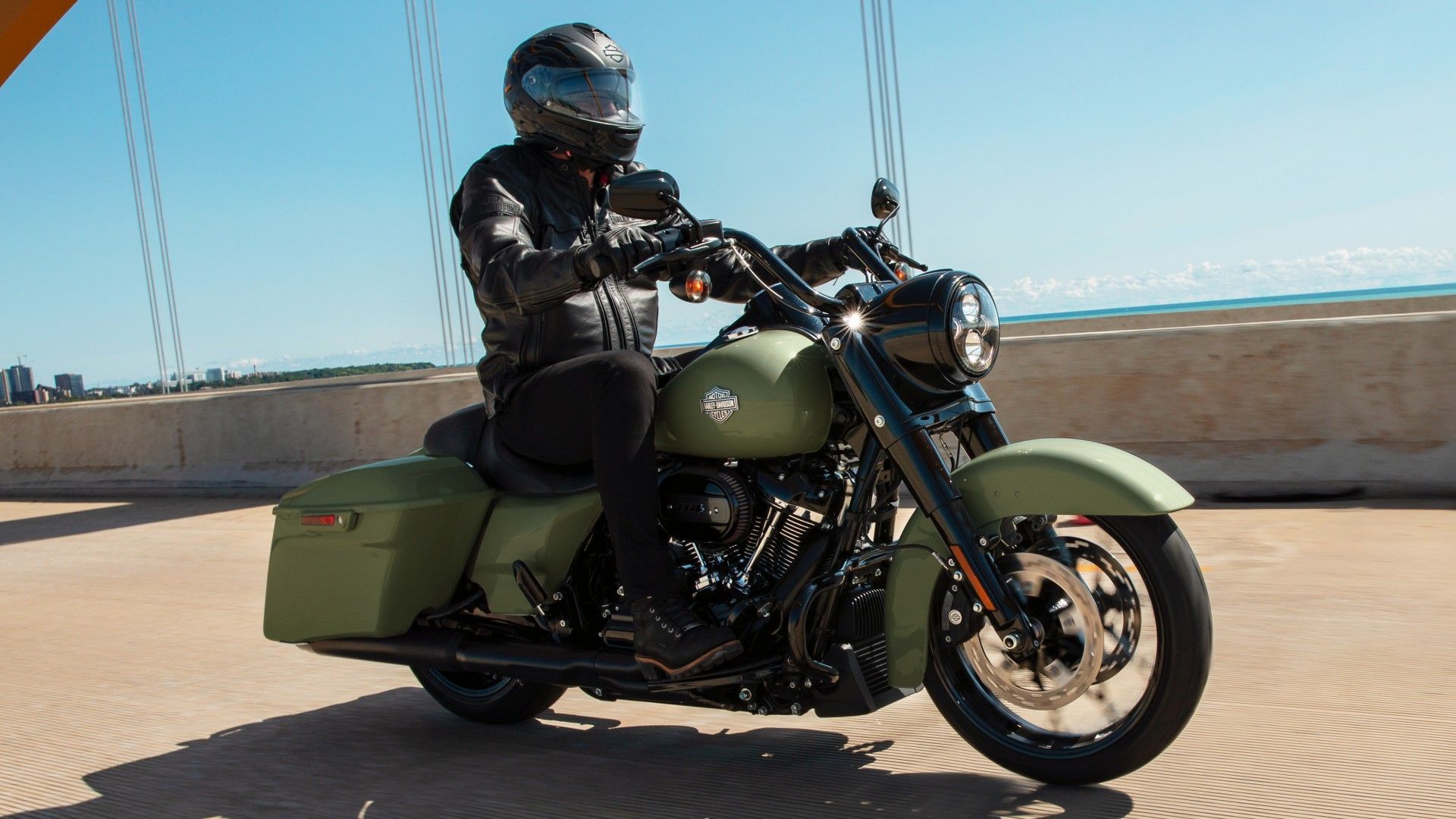 Harley-Davidson Road King Special in unique matte green cruising front third quarter view