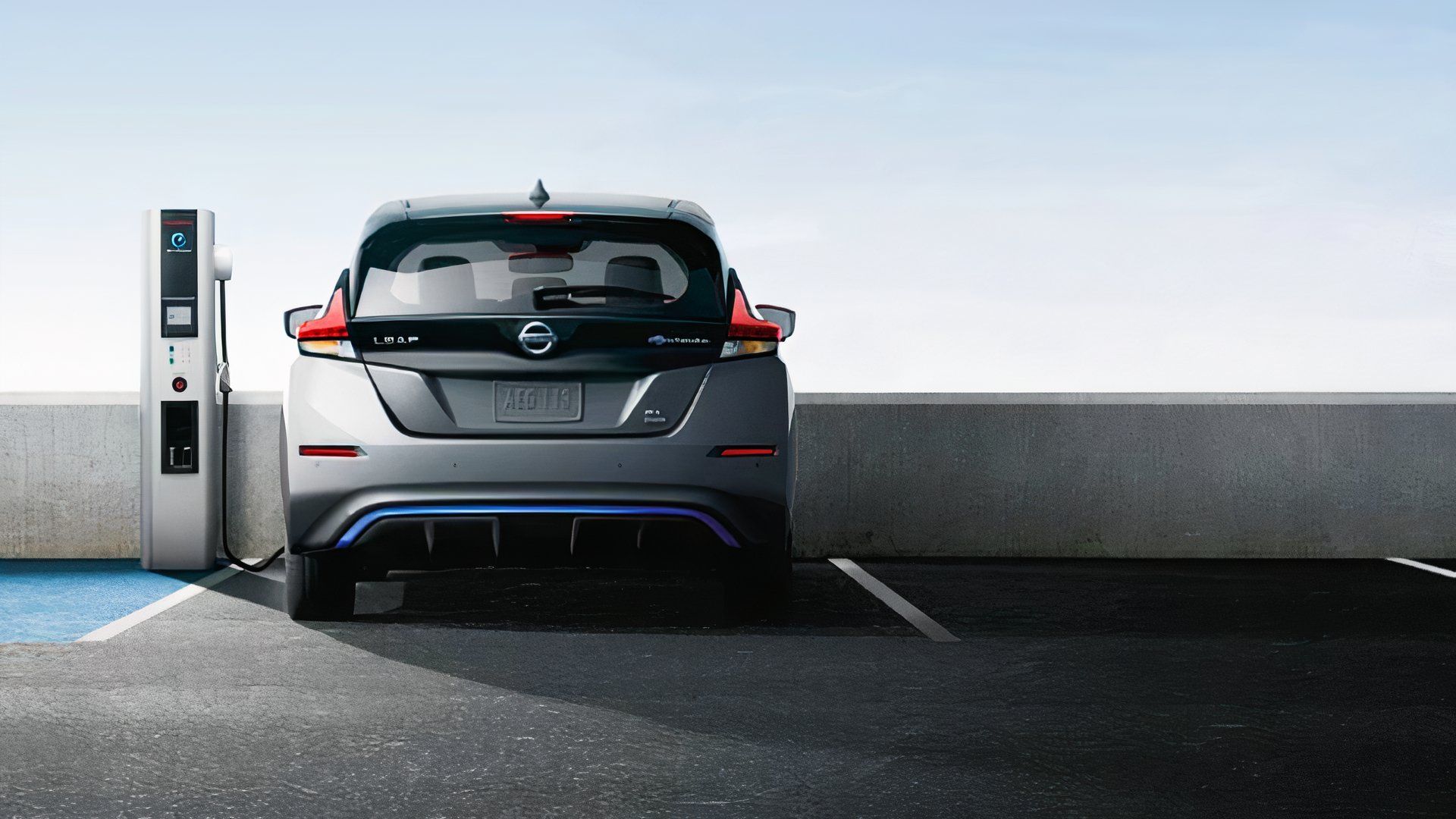 A 2022 Nissan Leaf is parked charging. 