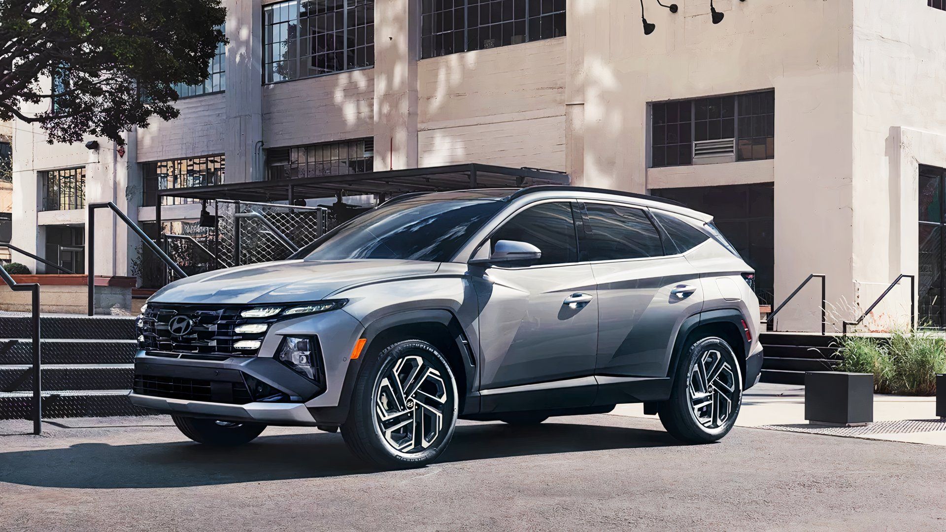 A gray 2025 Hyundai Tucson PHEV is parked. 