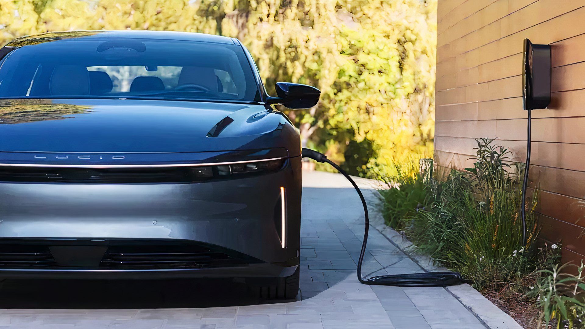 A gray 2025 Lucid Air is charging. 