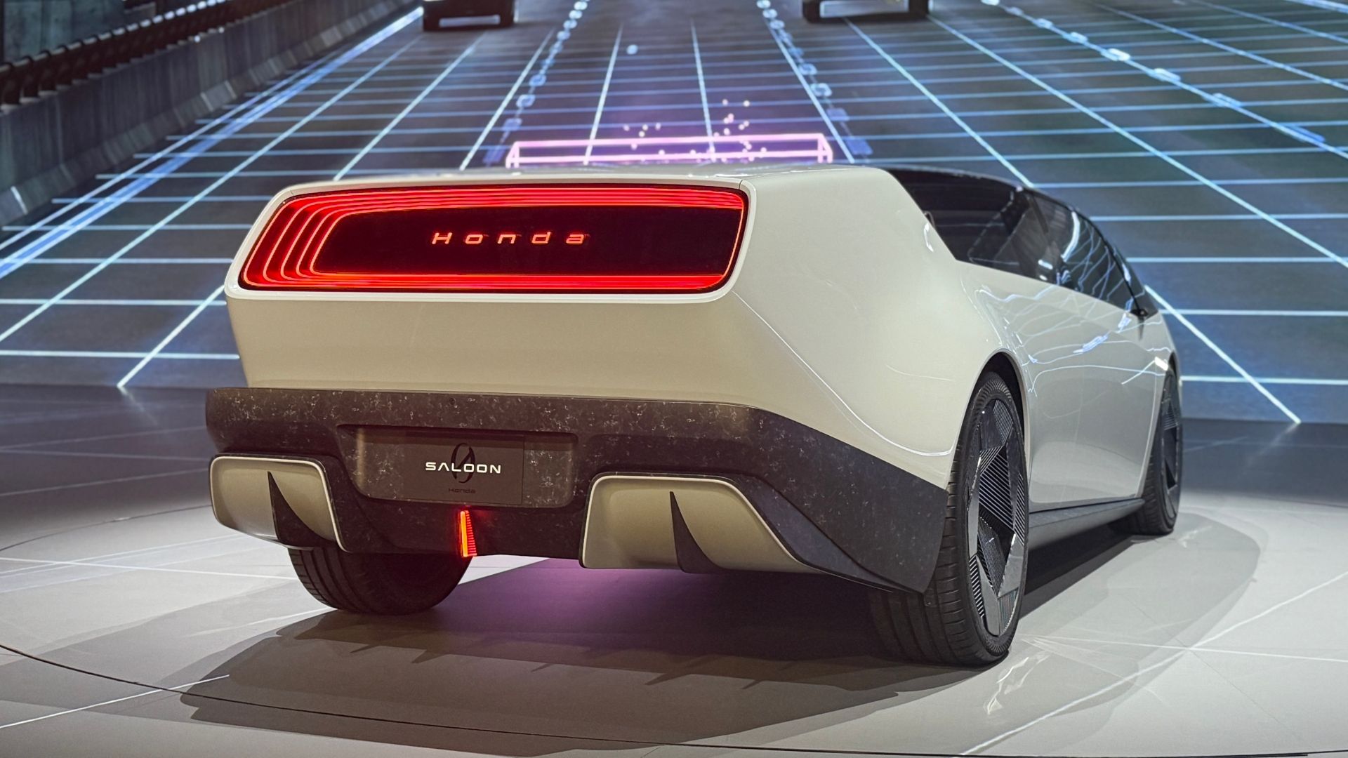 Rear three-quarters photo of the Honda 0 series Salon Prototype on stage on CES