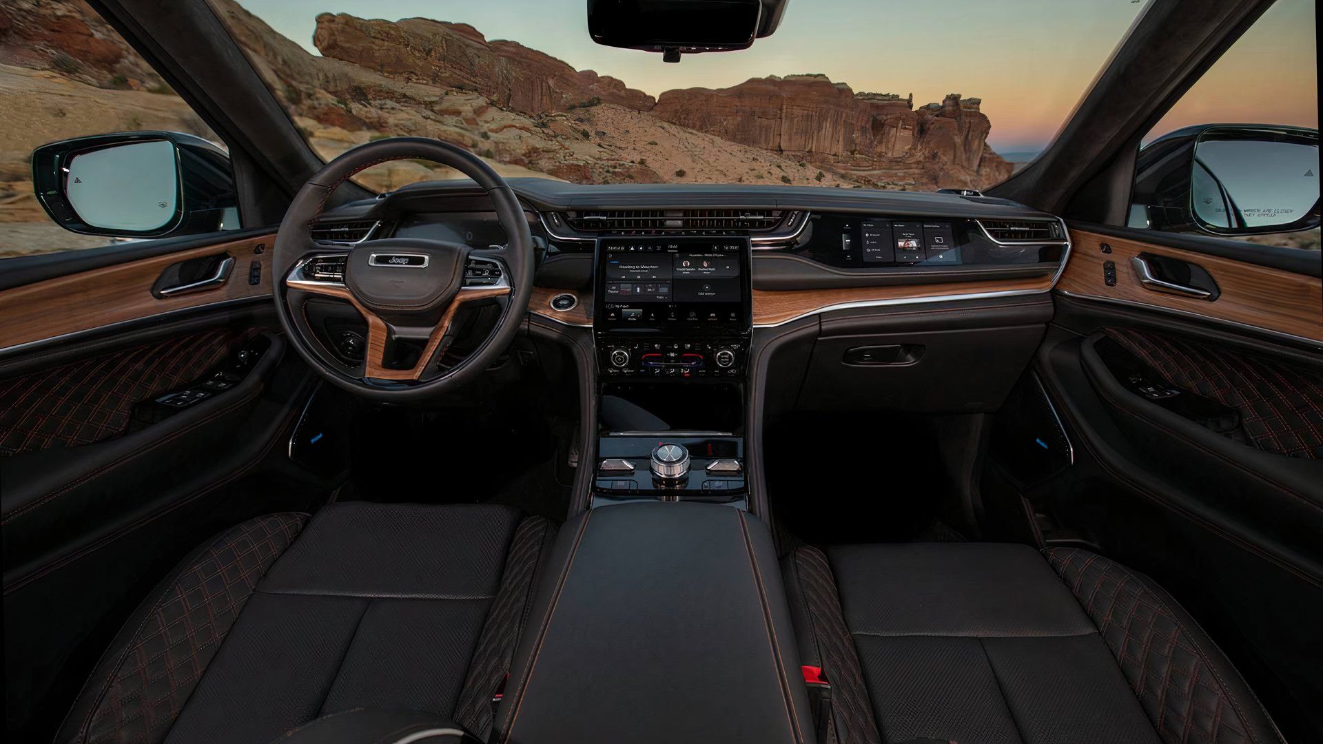2025 Jeep Grand Cherokee Summit Reserve interior showing dashboard and front cabin