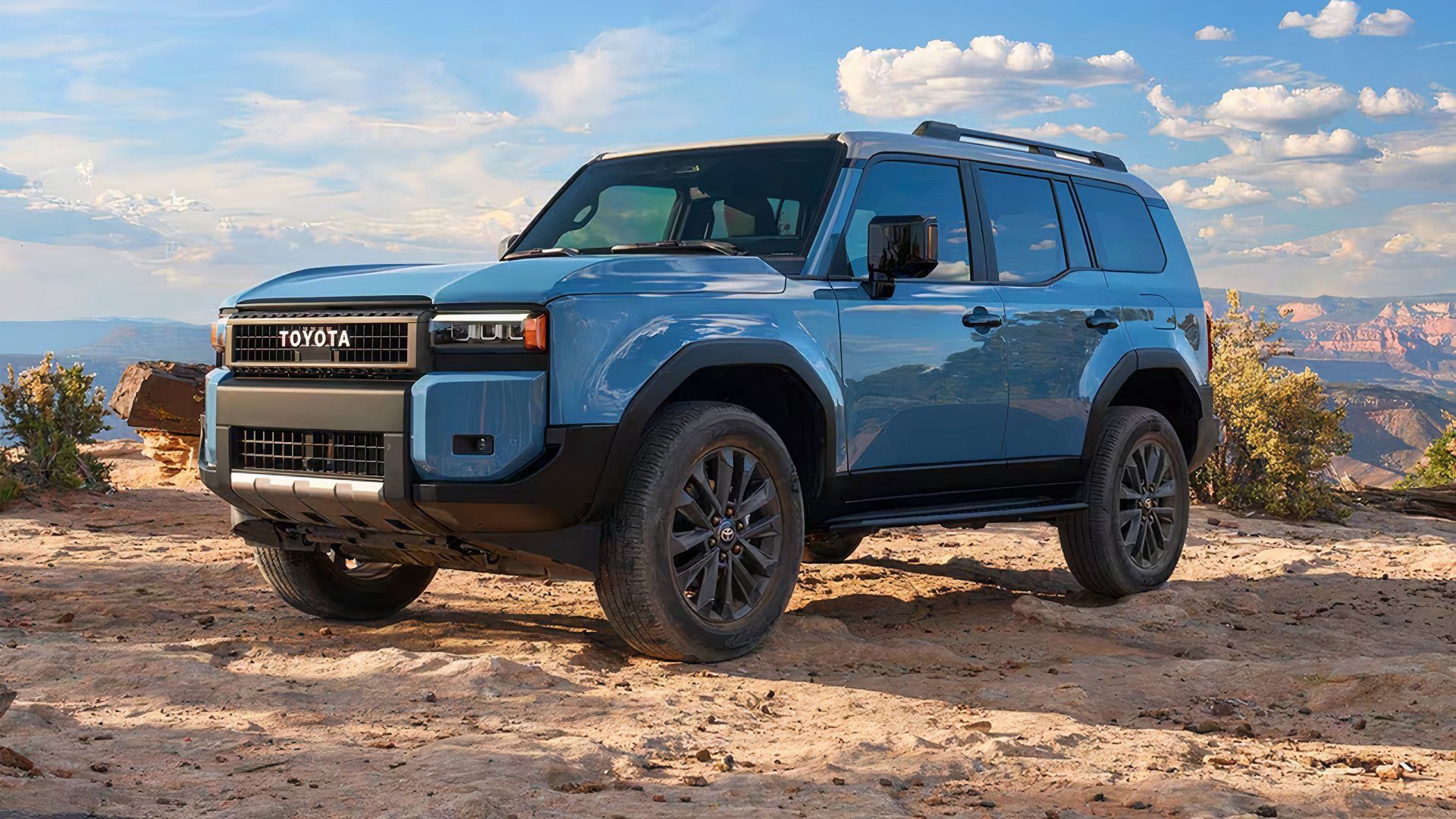 2025 Toyota Land Cruiser in blue parked on sand