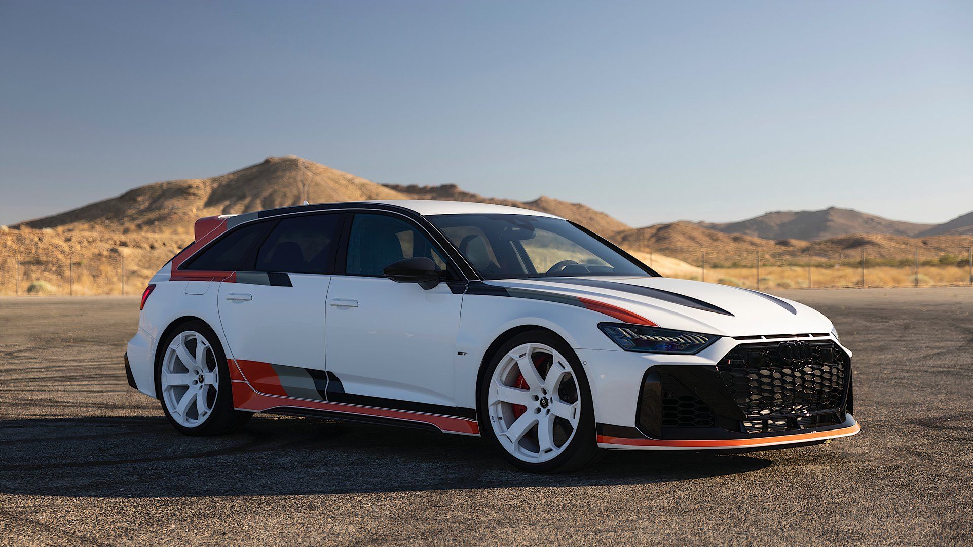 2025 Audi RS 6 Avant GT in white and orange parked
