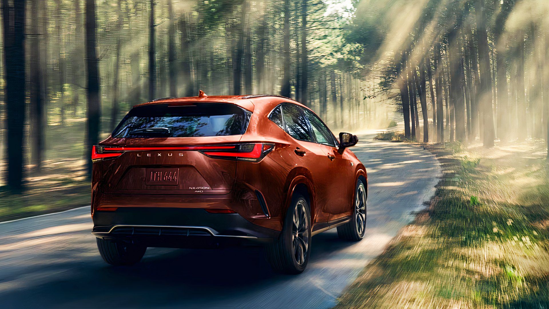 The rear of a Lexus NX PHEV SUV is driving on the road. 
