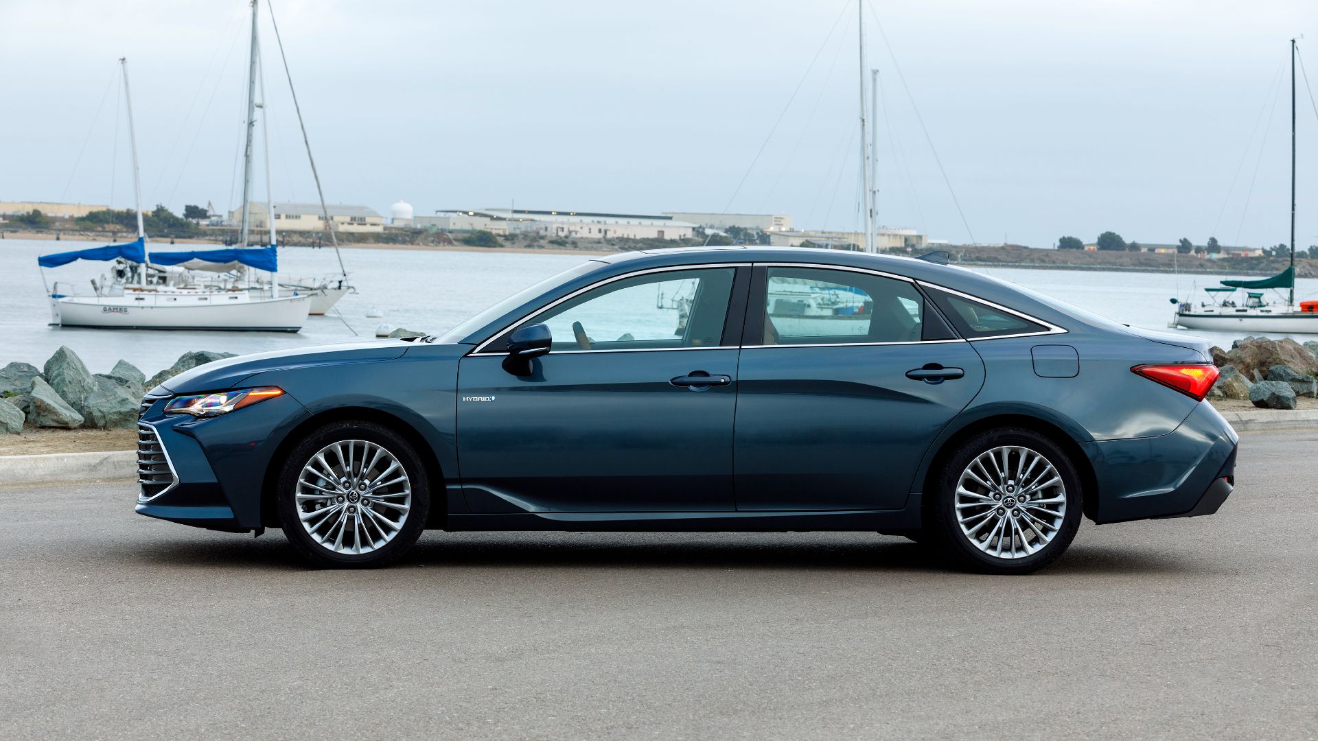 2020 Toyota Avalon Hybrid Limited Exterior Side Profile Parked In Front Of Waterway