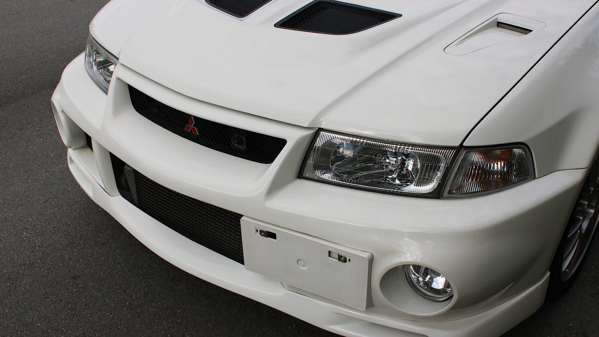 1999 Mitsubishi Lancer Evolution VI GSR in bumper, hood, and headlights