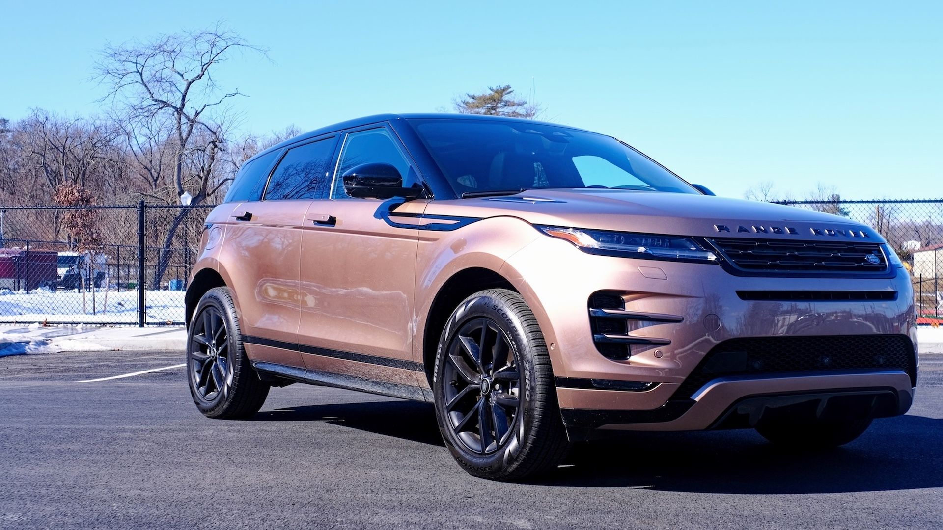 Static front three-quarters image of a gold 2025 Land Rover Range Rover Evoque Dynamic SE