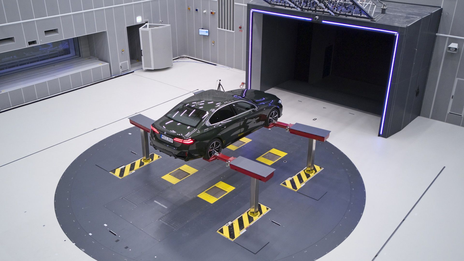 BMW green sedan on lift