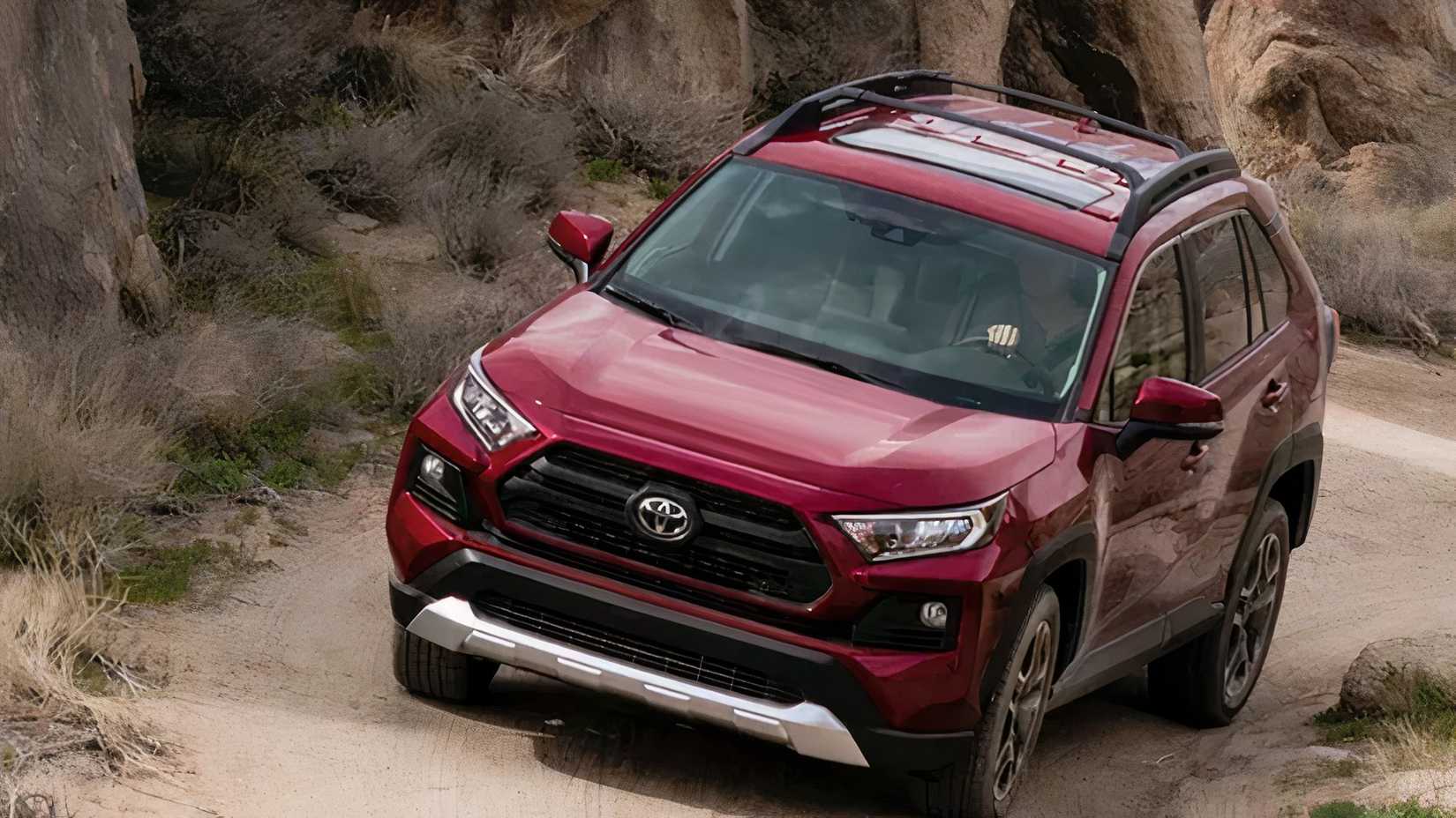 2020 Toyota RAV4 in red riding off-road