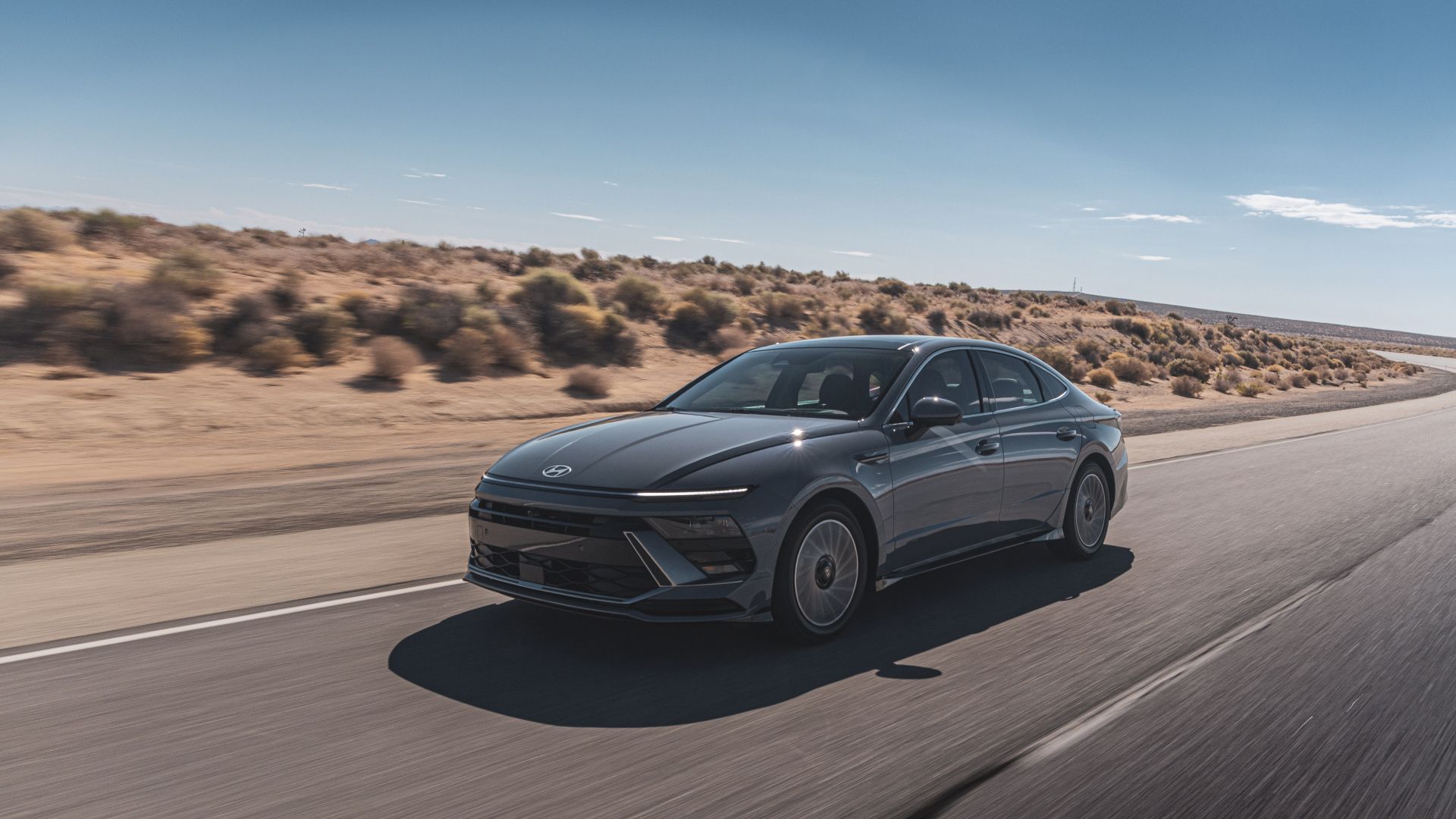 2025 Hyundai Sonata Hybrid Limited Exterior Driving Down Road