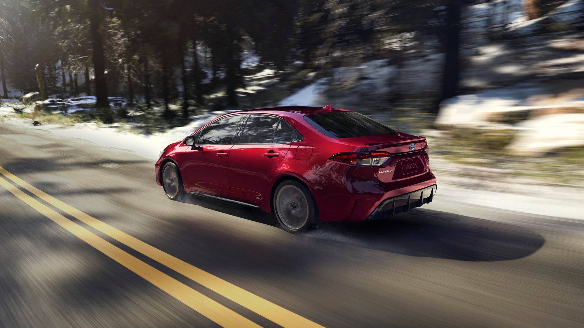 2025 Toyota Corolla Hybrid Rear Three-Quarter Driving 02