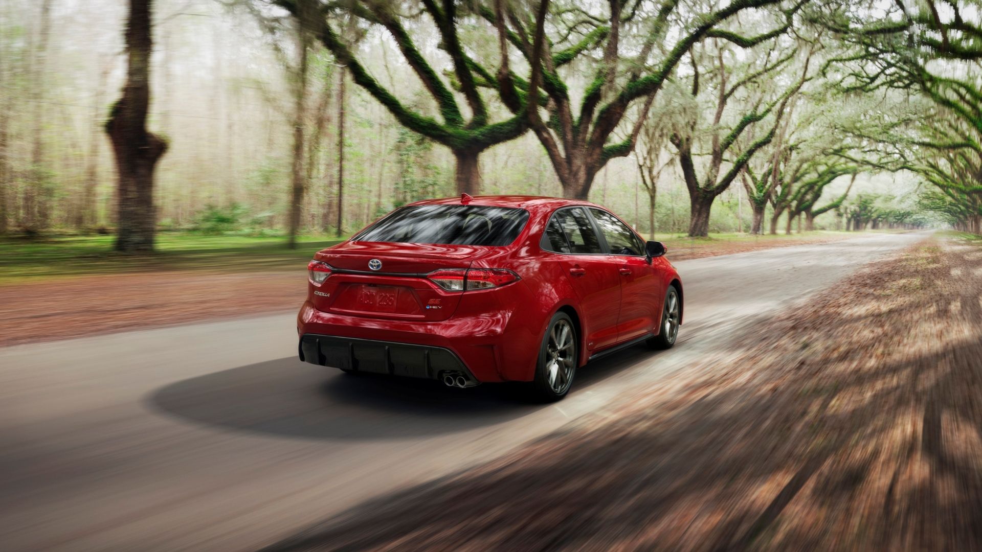 2025 Toyota Corolla Hybrid Rear Three-Quarter Driving 03