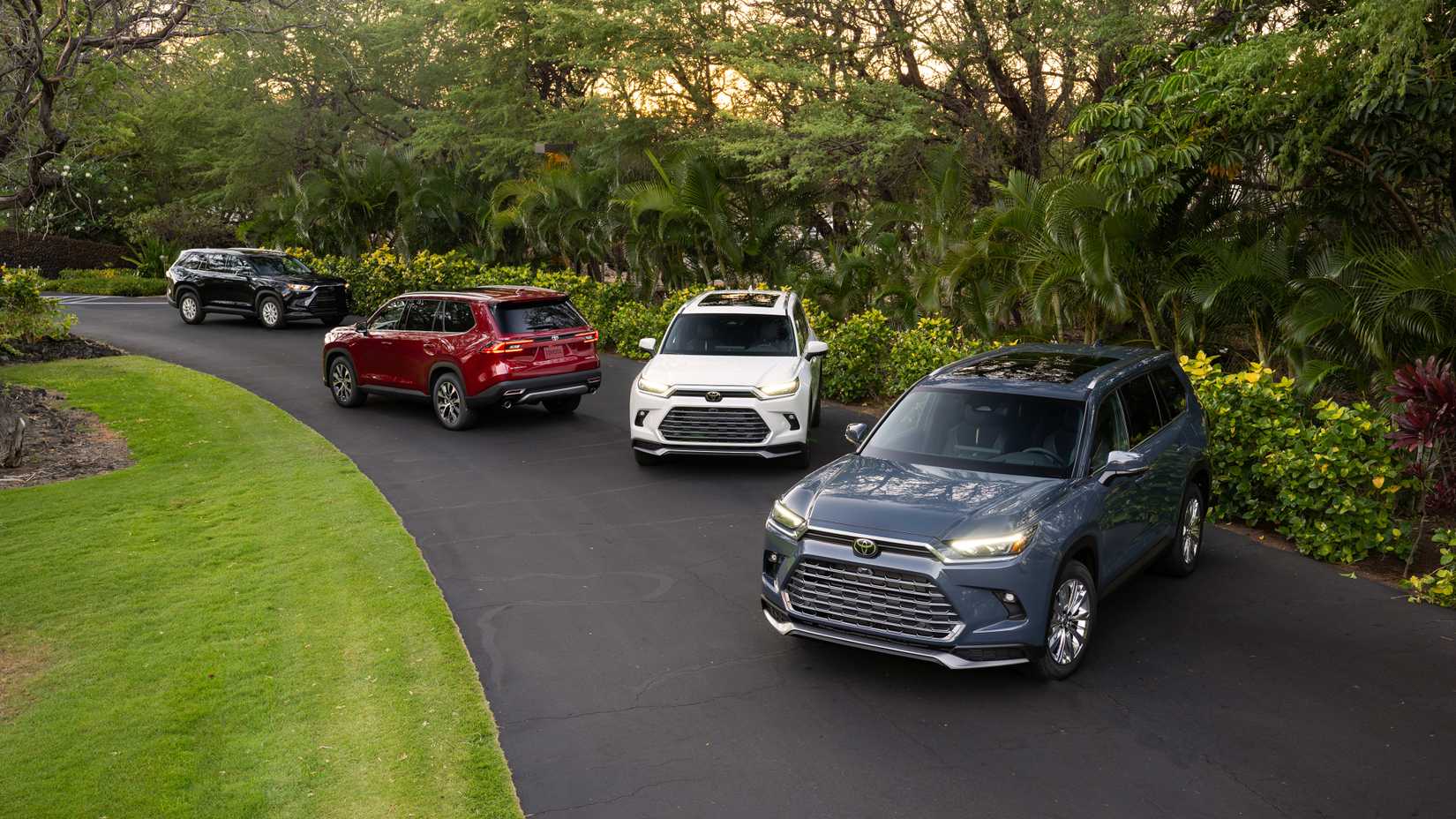 Four 2025 Toyota Grand Highlanders Parked On Driveway