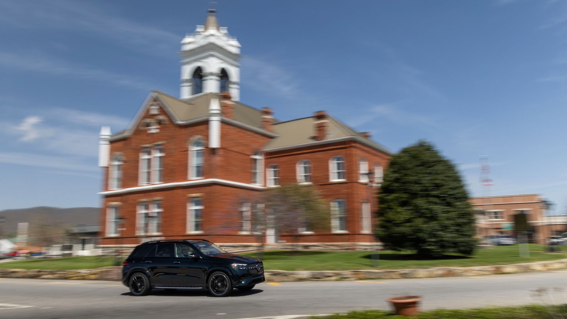 2024 Mercedes GLE 450 Exterior Driving Past Church