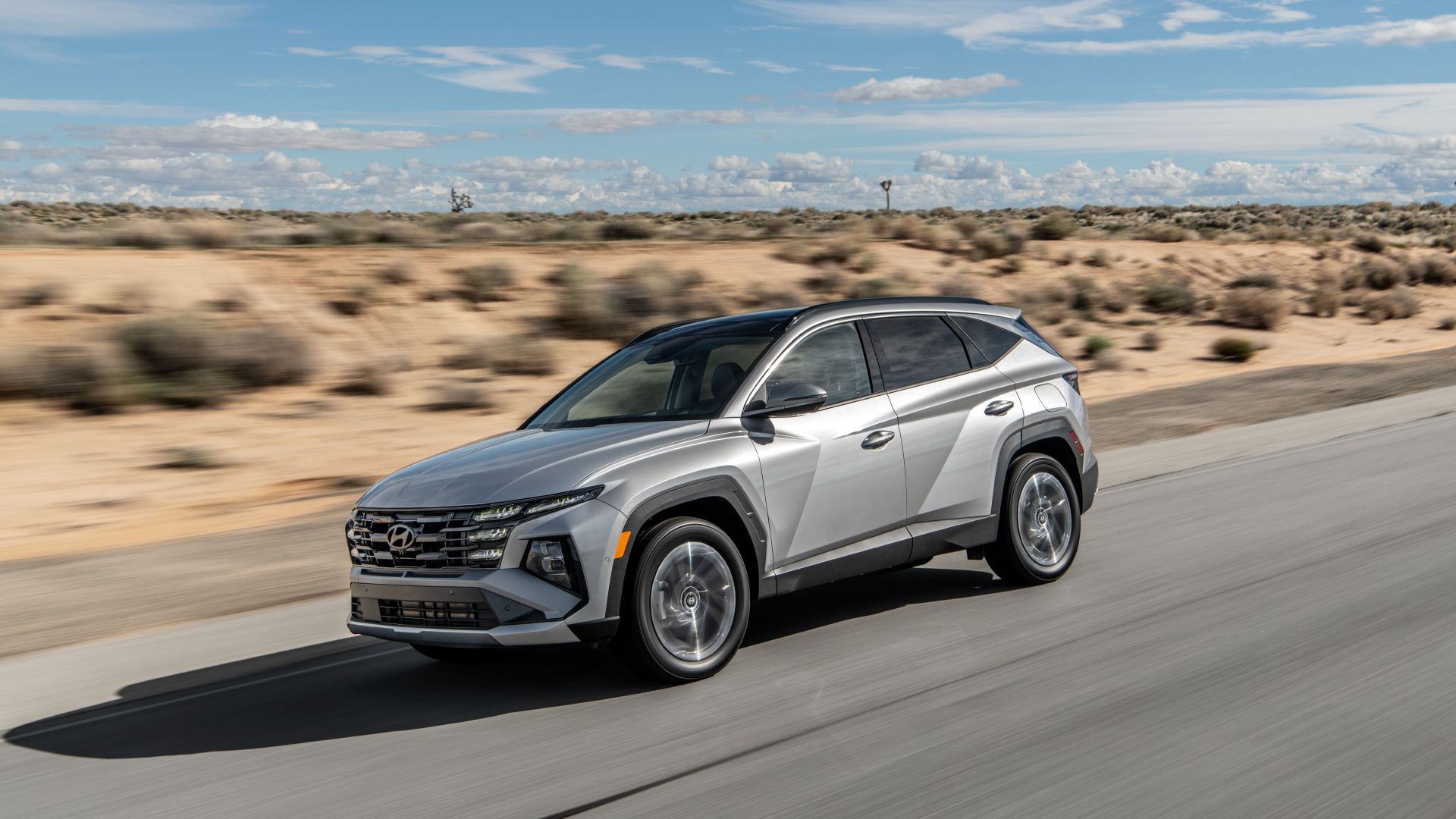 2025 Hyundai Tucson Plug-In Hybrid Exterior Driving Down Road